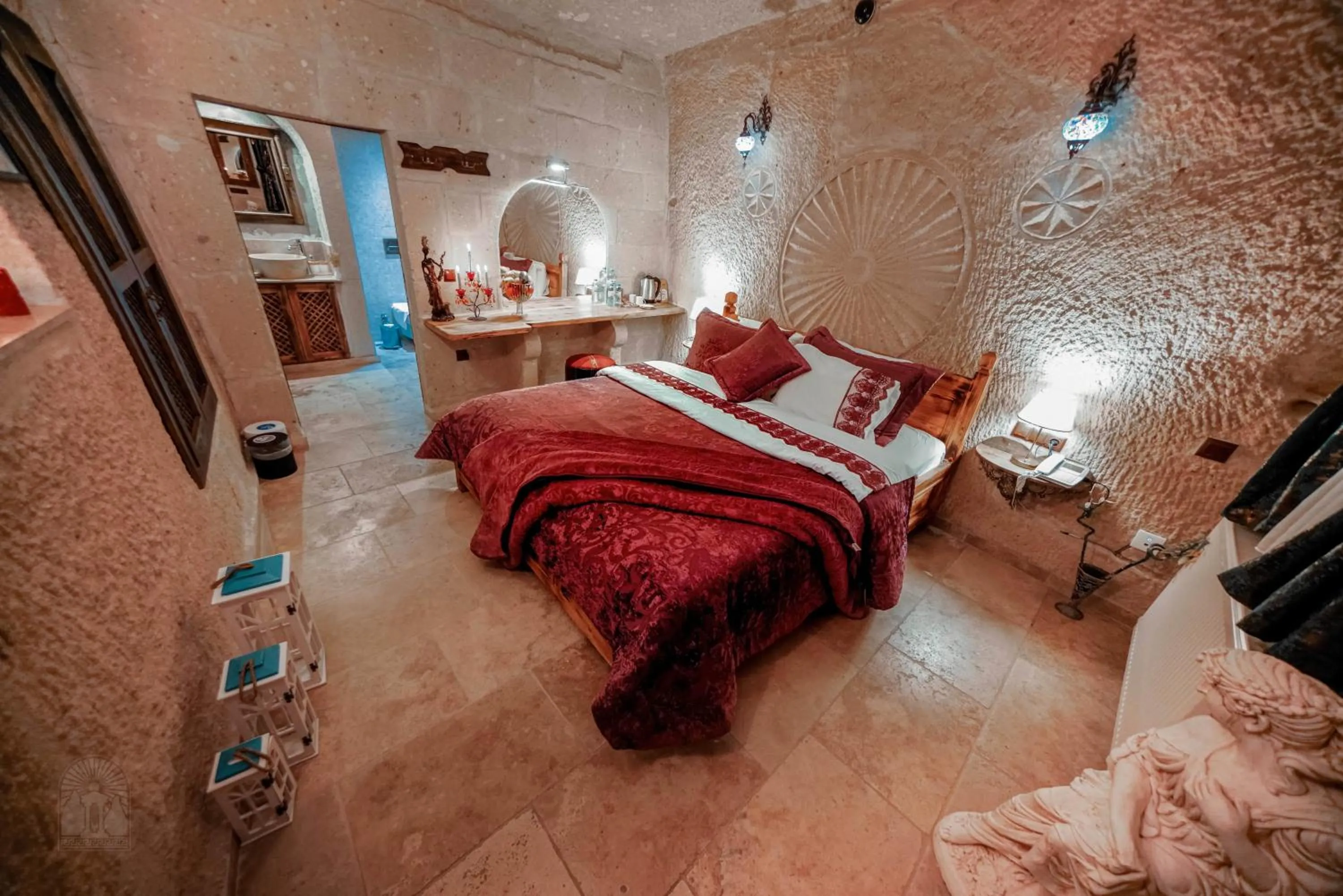 Bed in Zeus Cave Suites