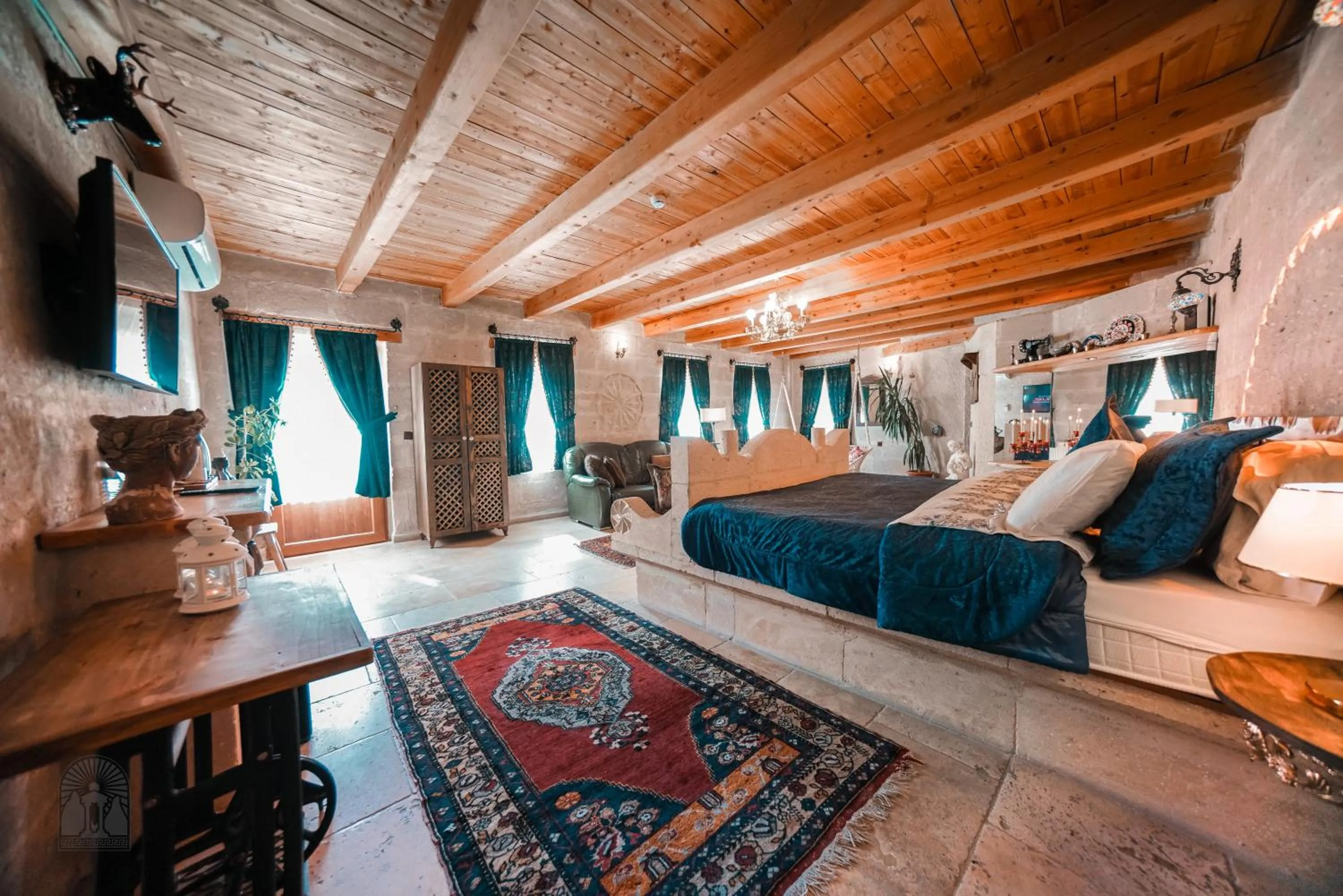 Bed in Zeus Cave Suites