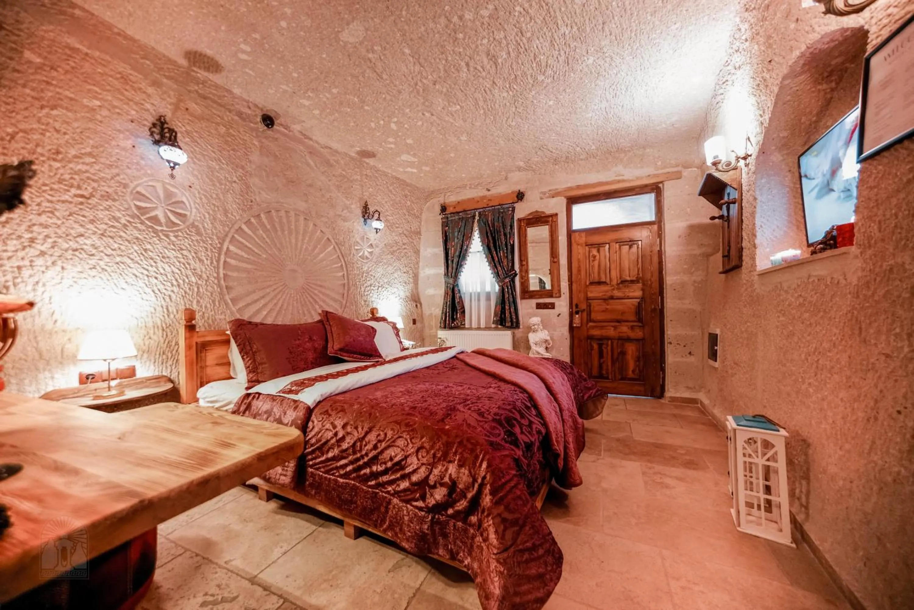 Bed in Zeus Cave Suites