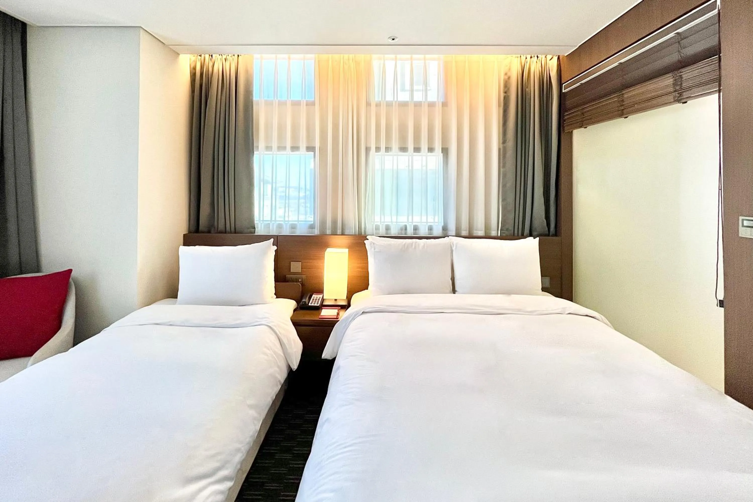 Bed in Ramada Encore by Wyndham Busan Station