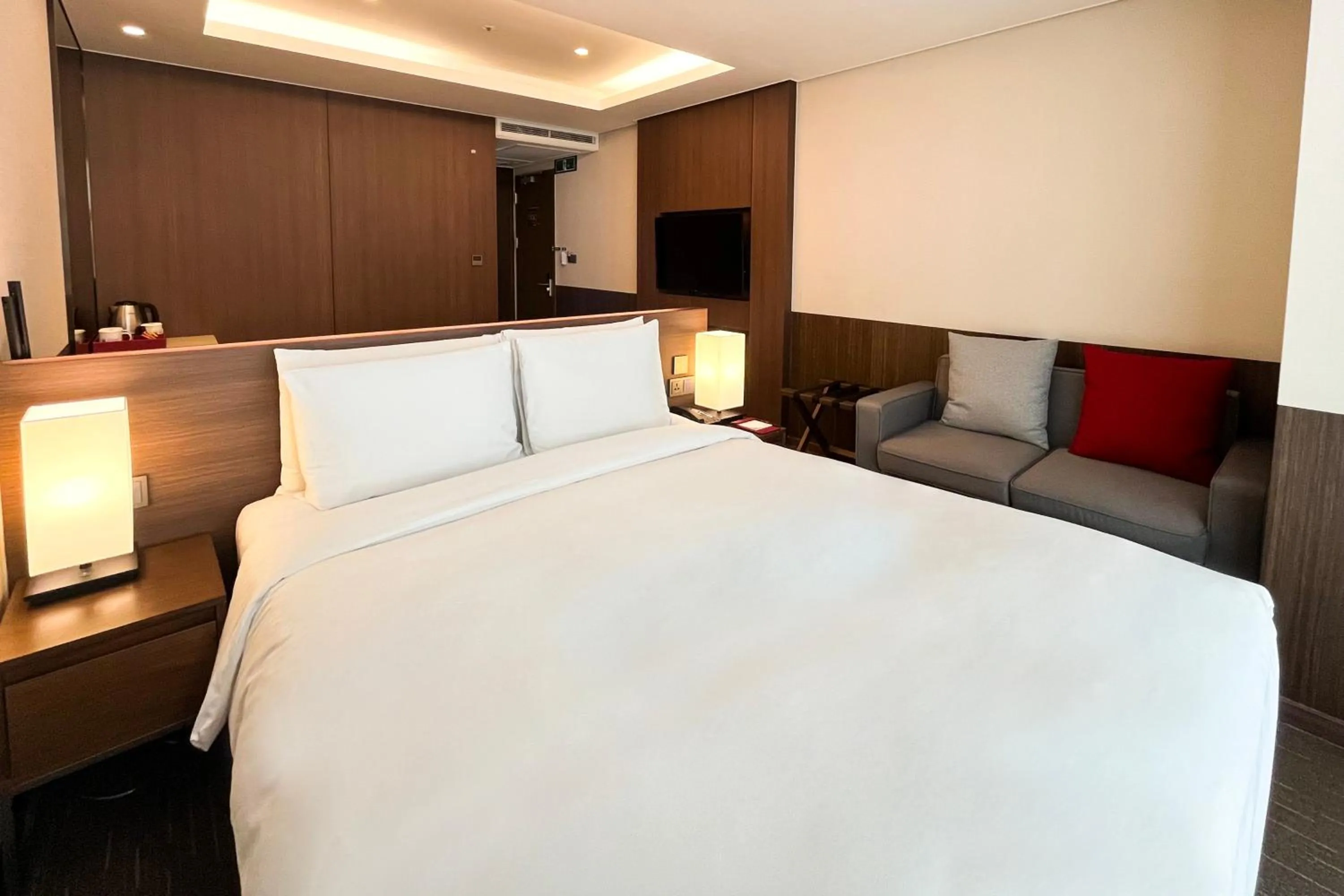 Bed in Ramada Encore by Wyndham Busan Station
