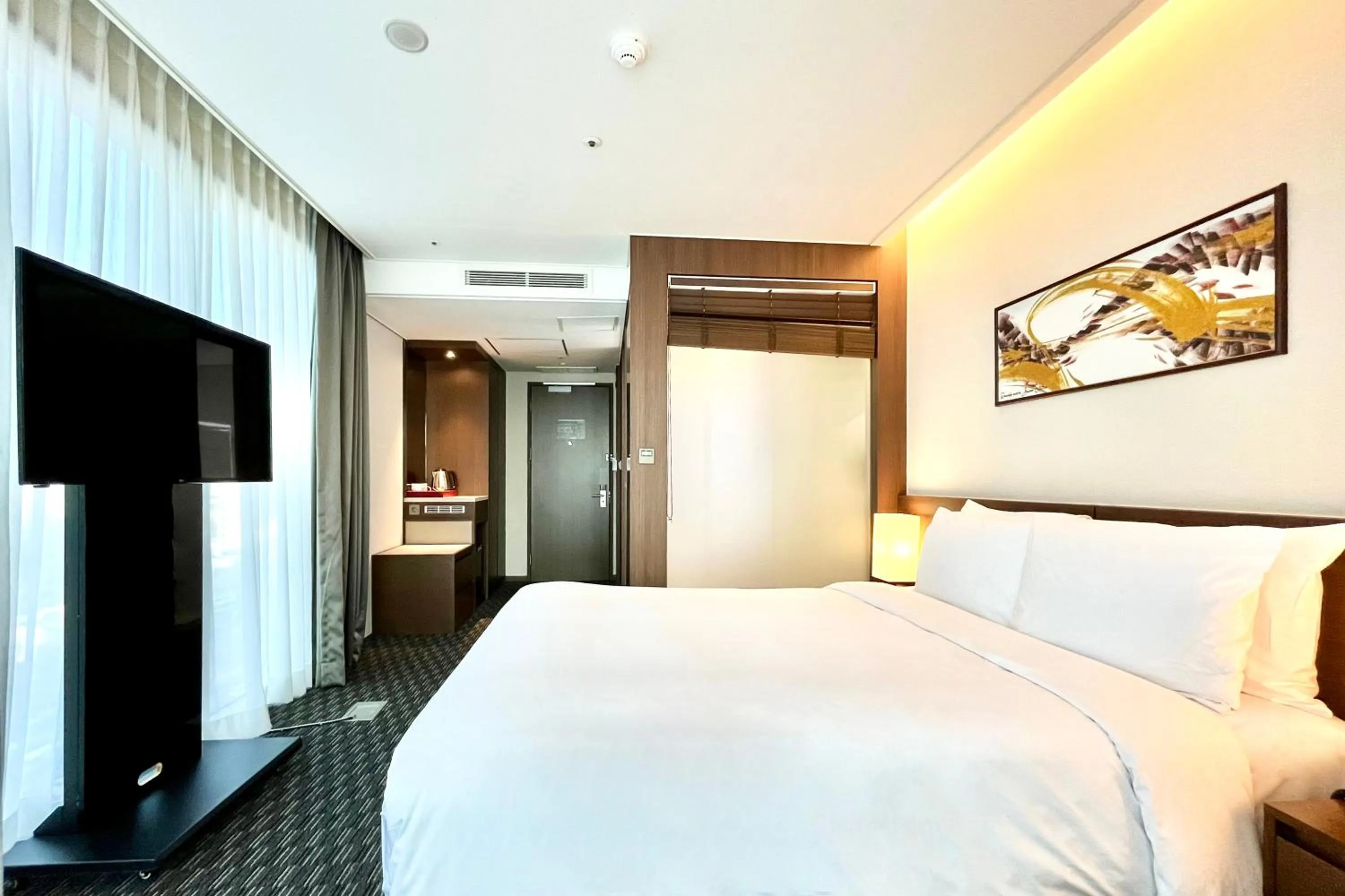Bed in Ramada Encore by Wyndham Busan Station