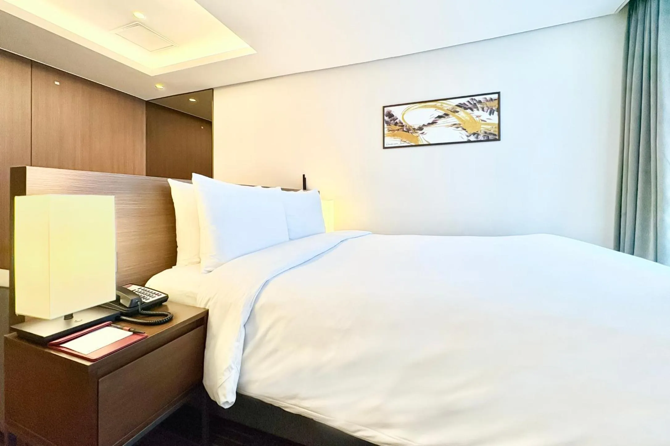 Bed in Ramada Encore by Wyndham Busan Station