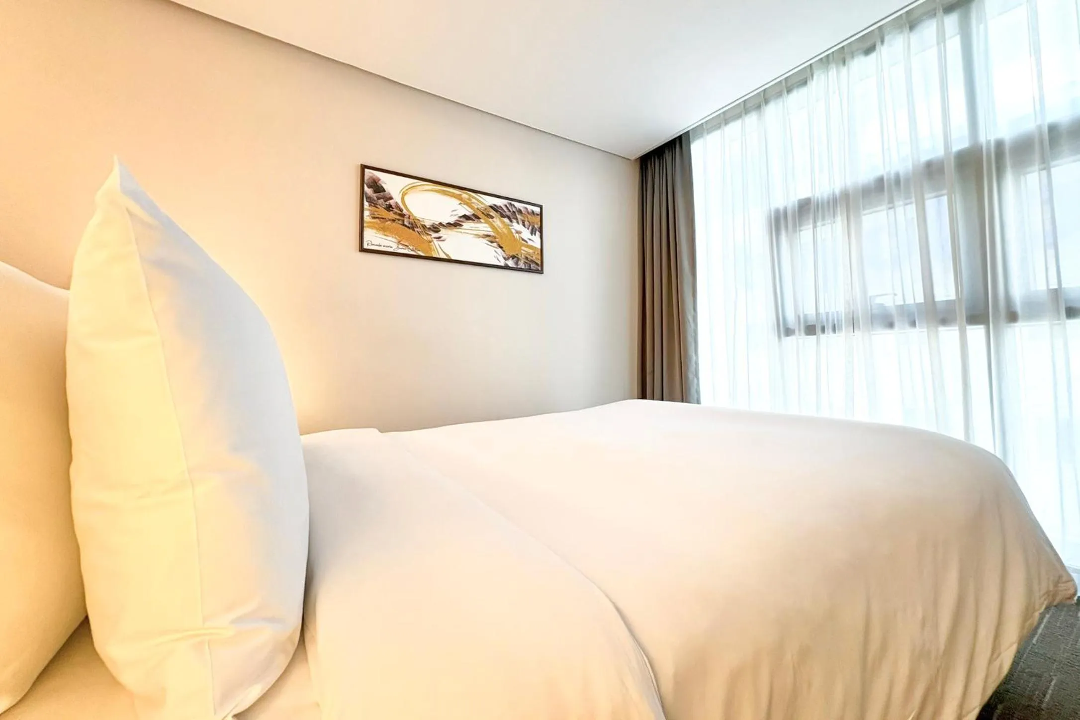 Bed in Ramada Encore by Wyndham Busan Station