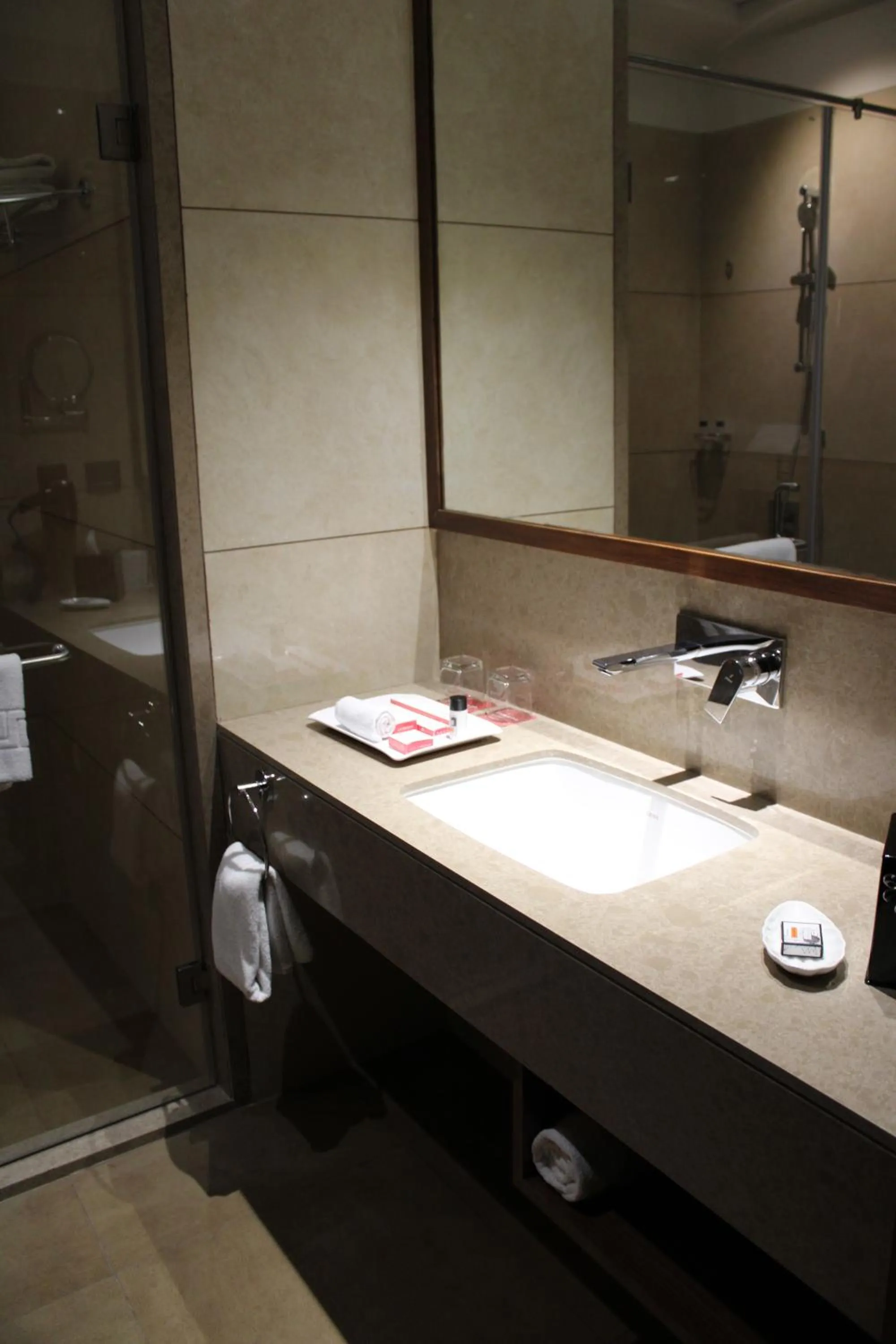 Bathroom in Ramada by Wyndham Gandhidham Shinay
