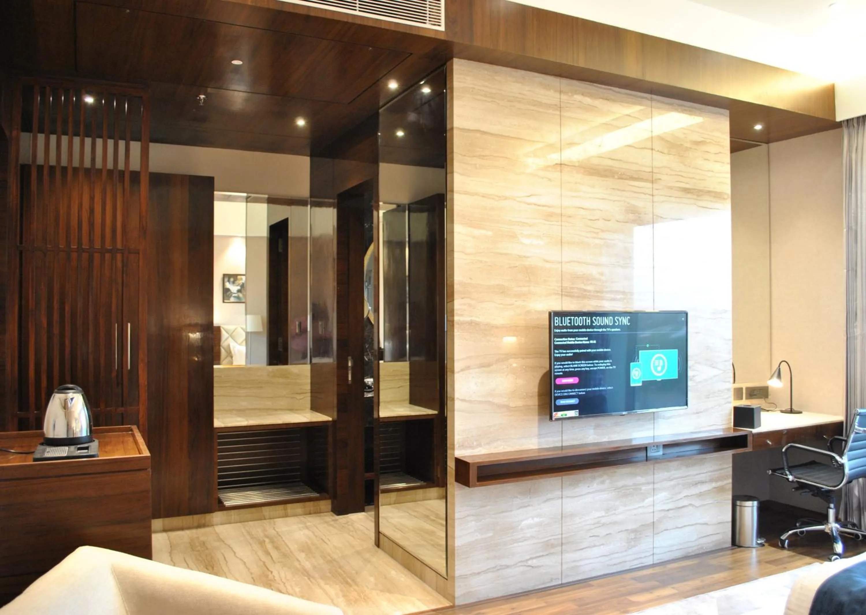 TV and multimedia in Ramada by Wyndham Gandhidham Shinay