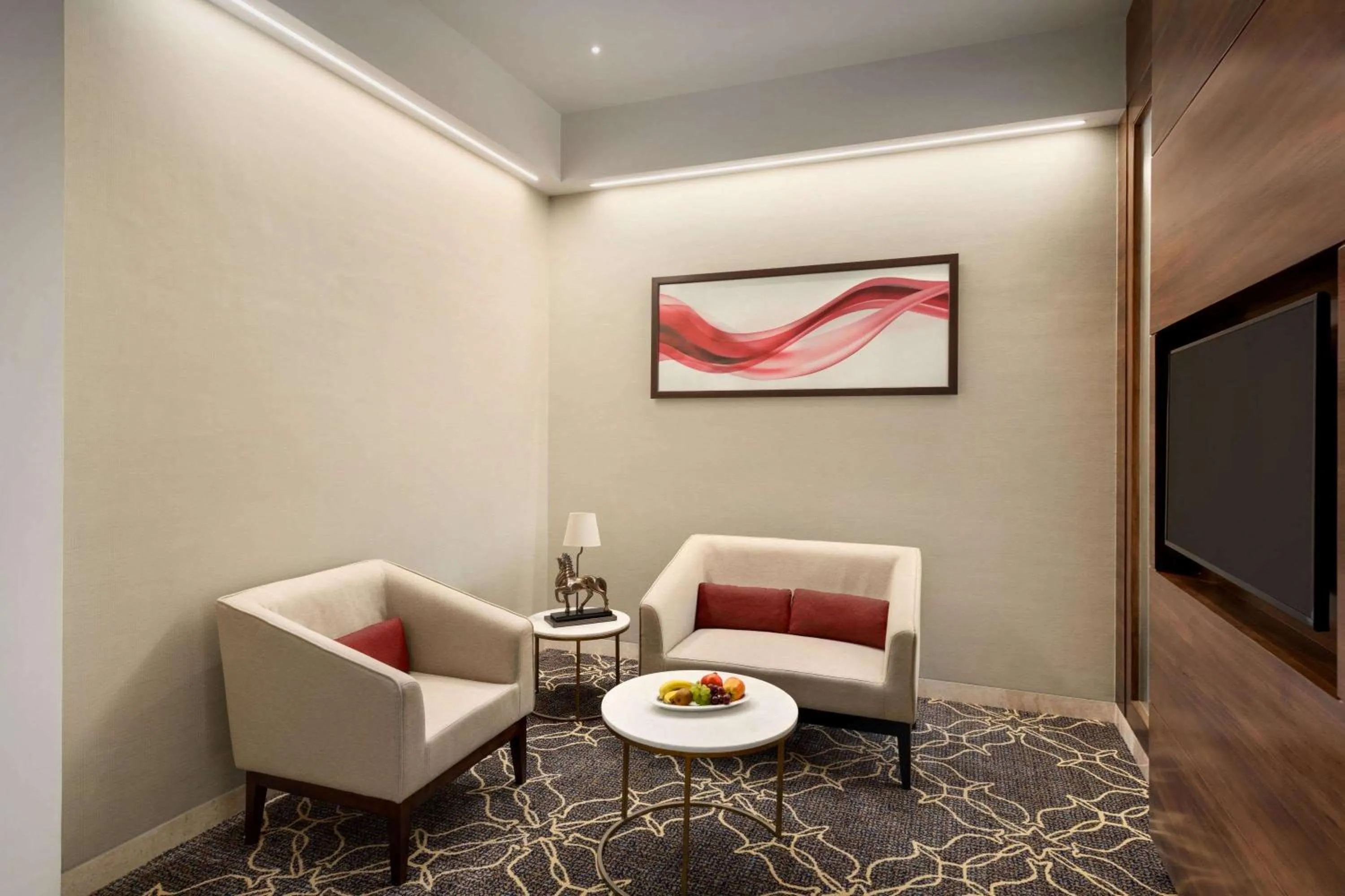 Photo of the whole room in Ramada by Wyndham Gandhidham Shinay