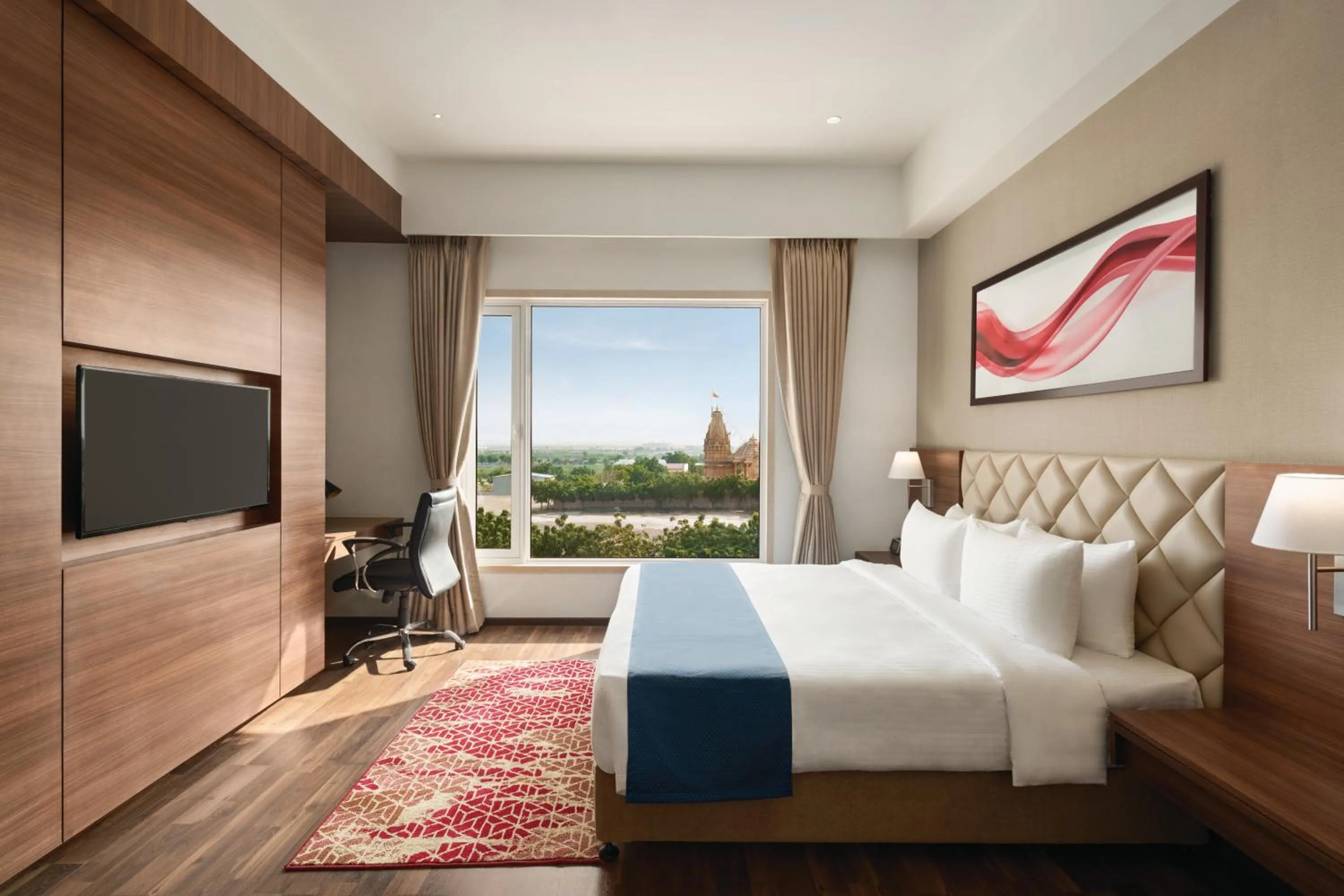 Photo of the whole room, Bed in Ramada by Wyndham Gandhidham Shinay