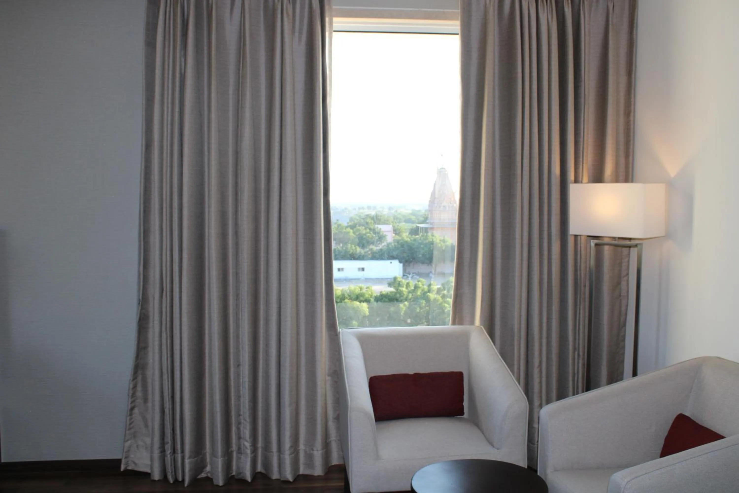 Seating area in Ramada by Wyndham Gandhidham Shinay