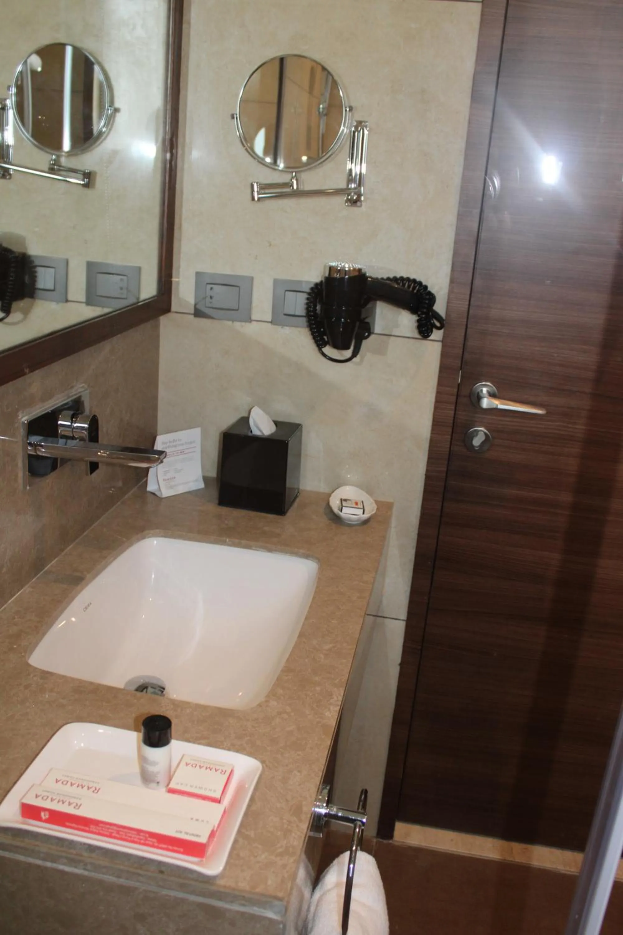 Bathroom in Ramada by Wyndham Gandhidham Shinay