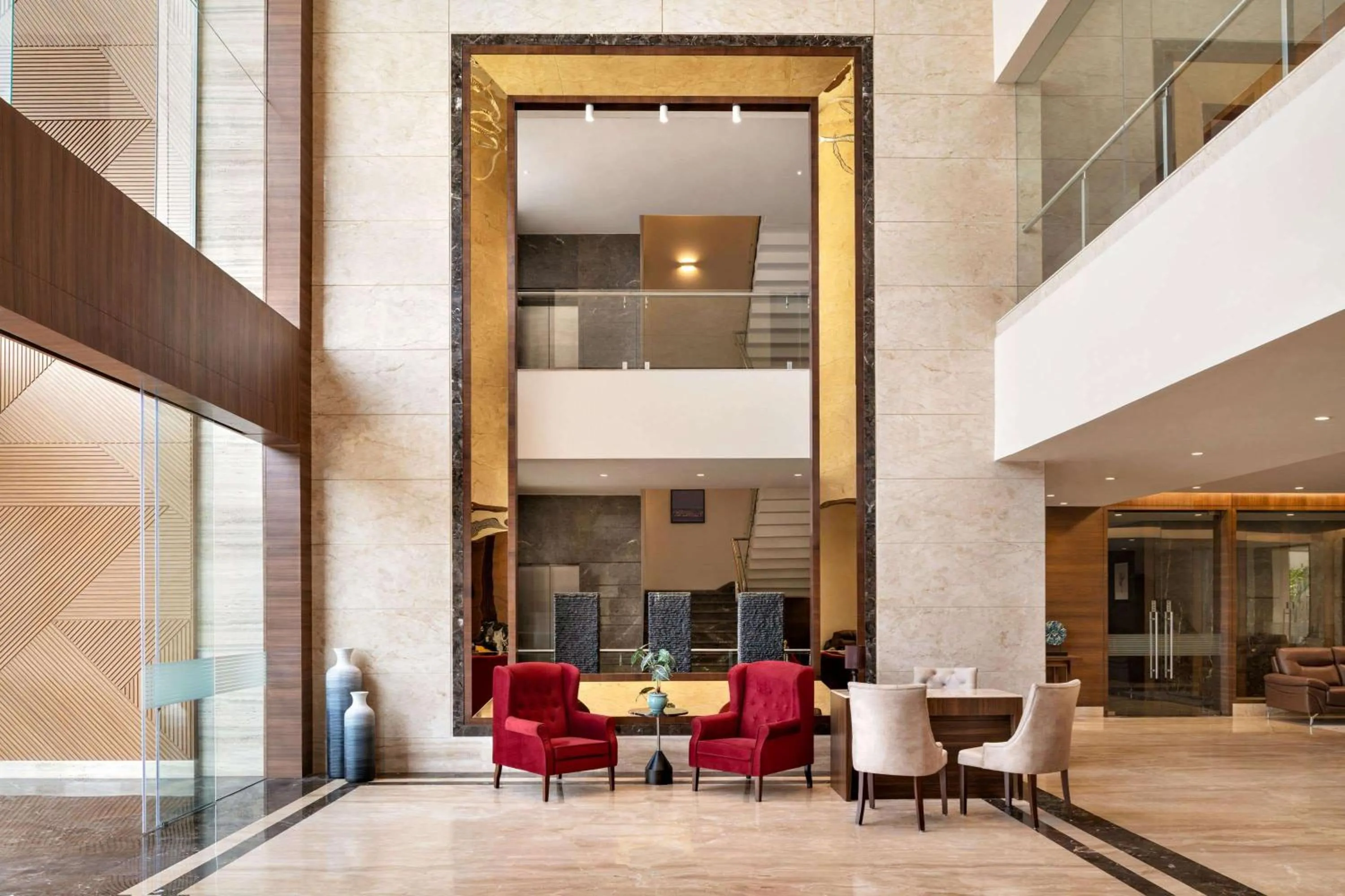 Lobby or reception in Ramada by Wyndham Gandhidham Shinay