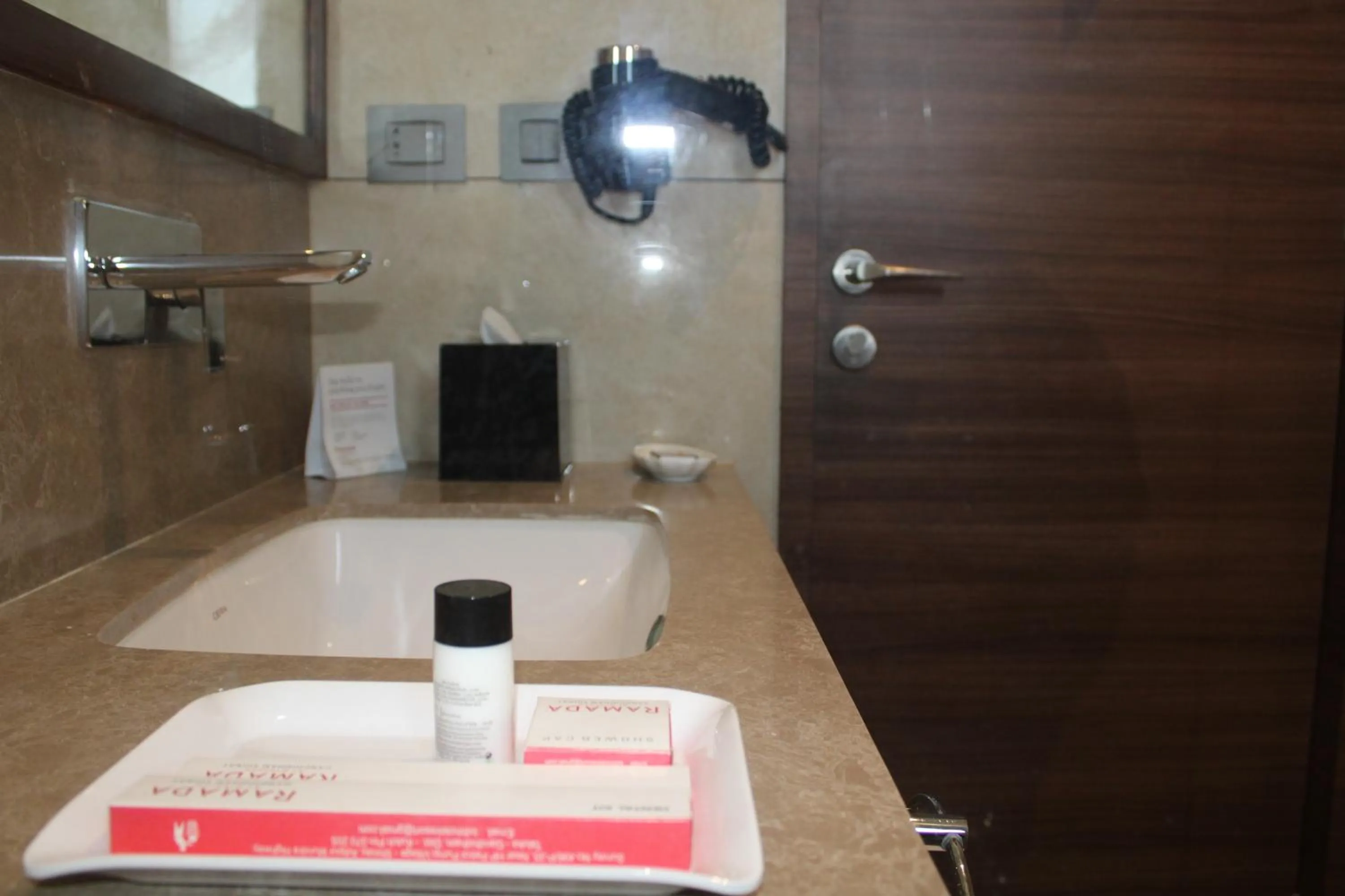 Bathroom in Ramada by Wyndham Gandhidham Shinay