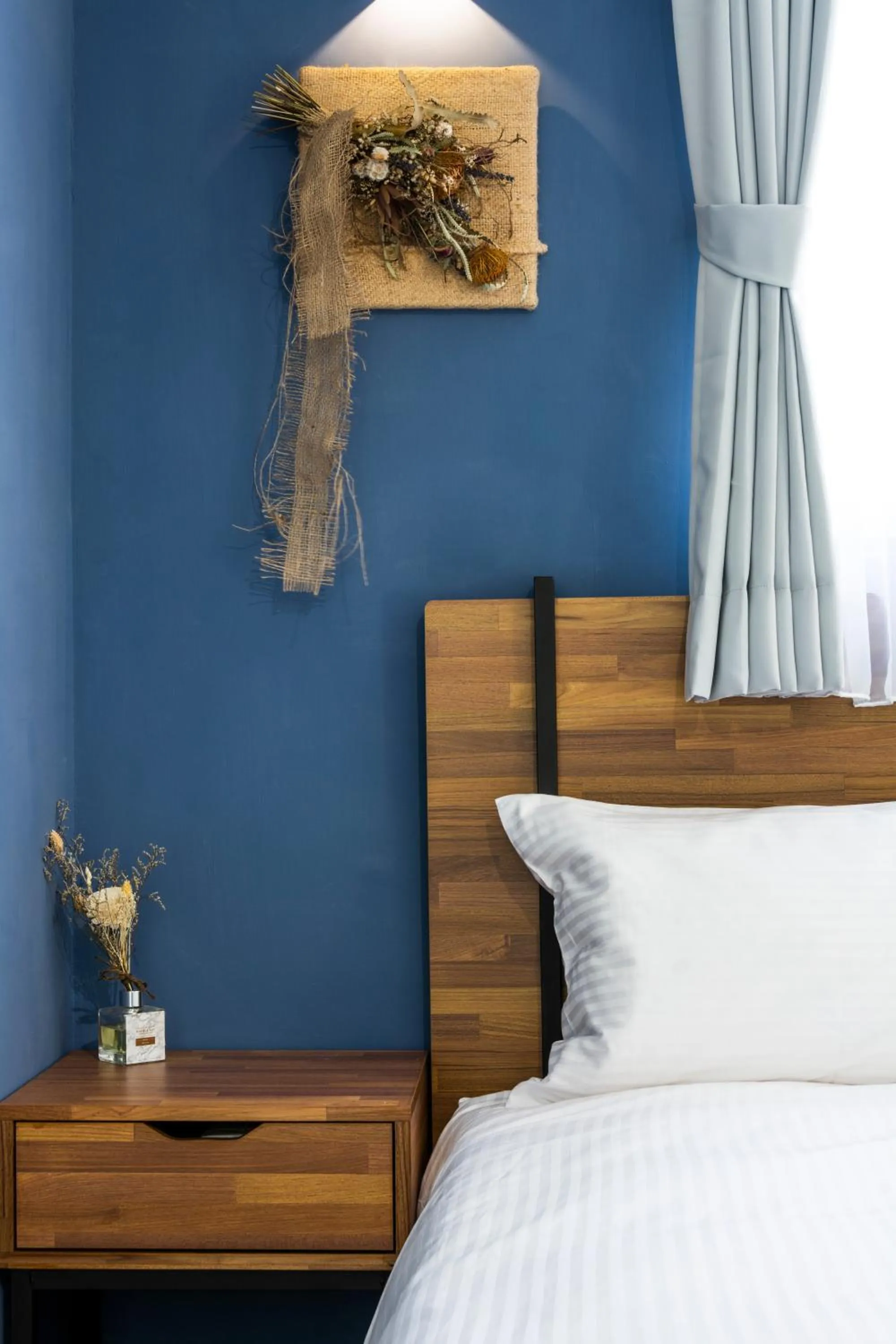 Bed in 沐藍輕旅 Mulan Light Inn I 海安路住宿