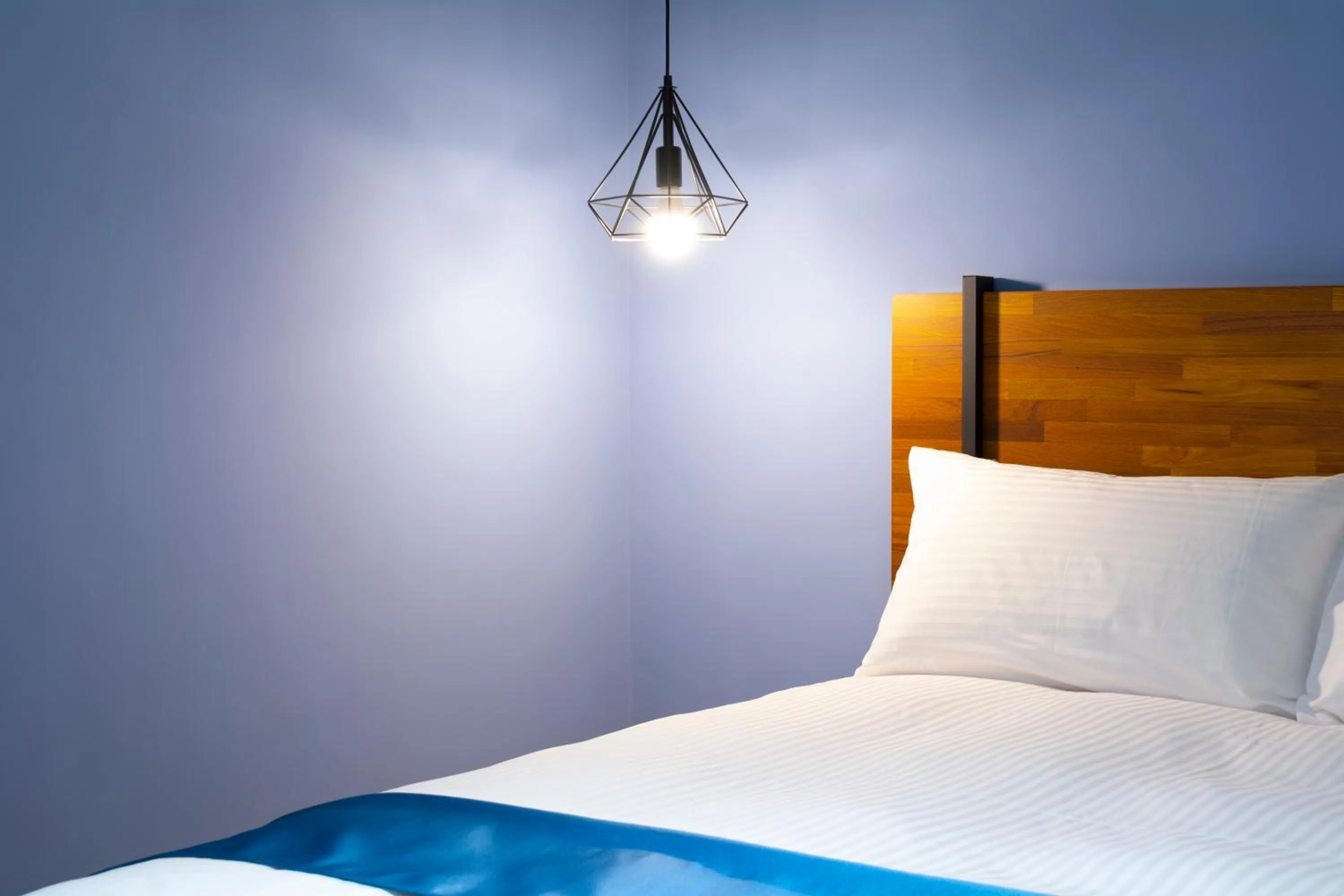 Bed in 沐藍輕旅 Mulan Light Inn I 海安路住宿