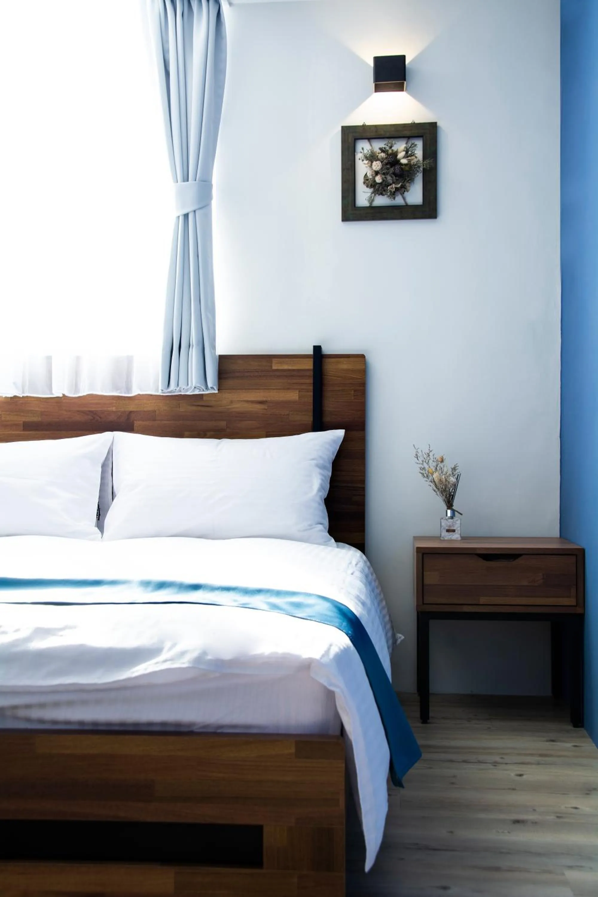 Bed in 沐藍輕旅 Mulan Light Inn I 海安路住宿