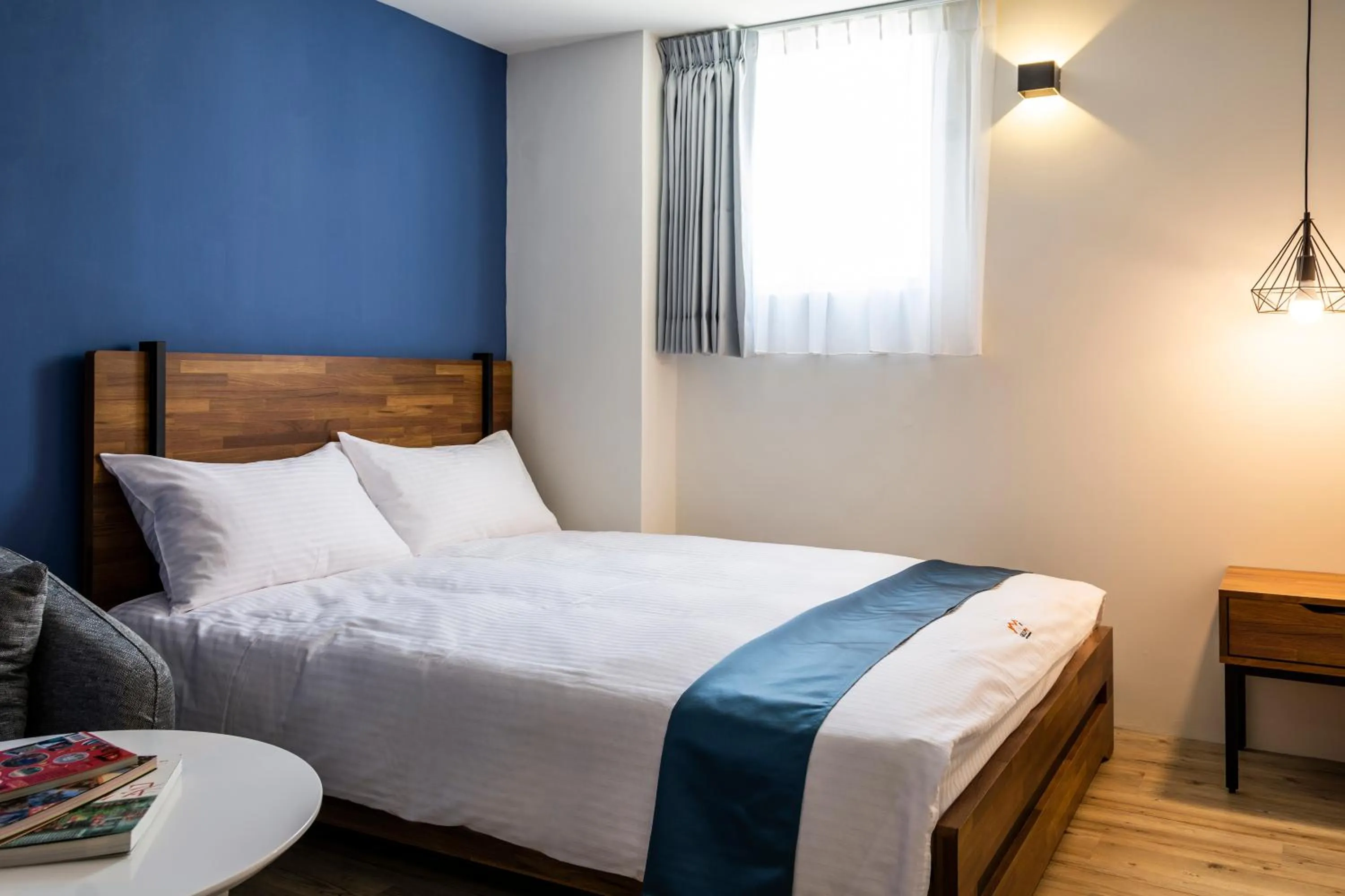 Bed in 沐藍輕旅 Mulan Light Inn I 海安路住宿