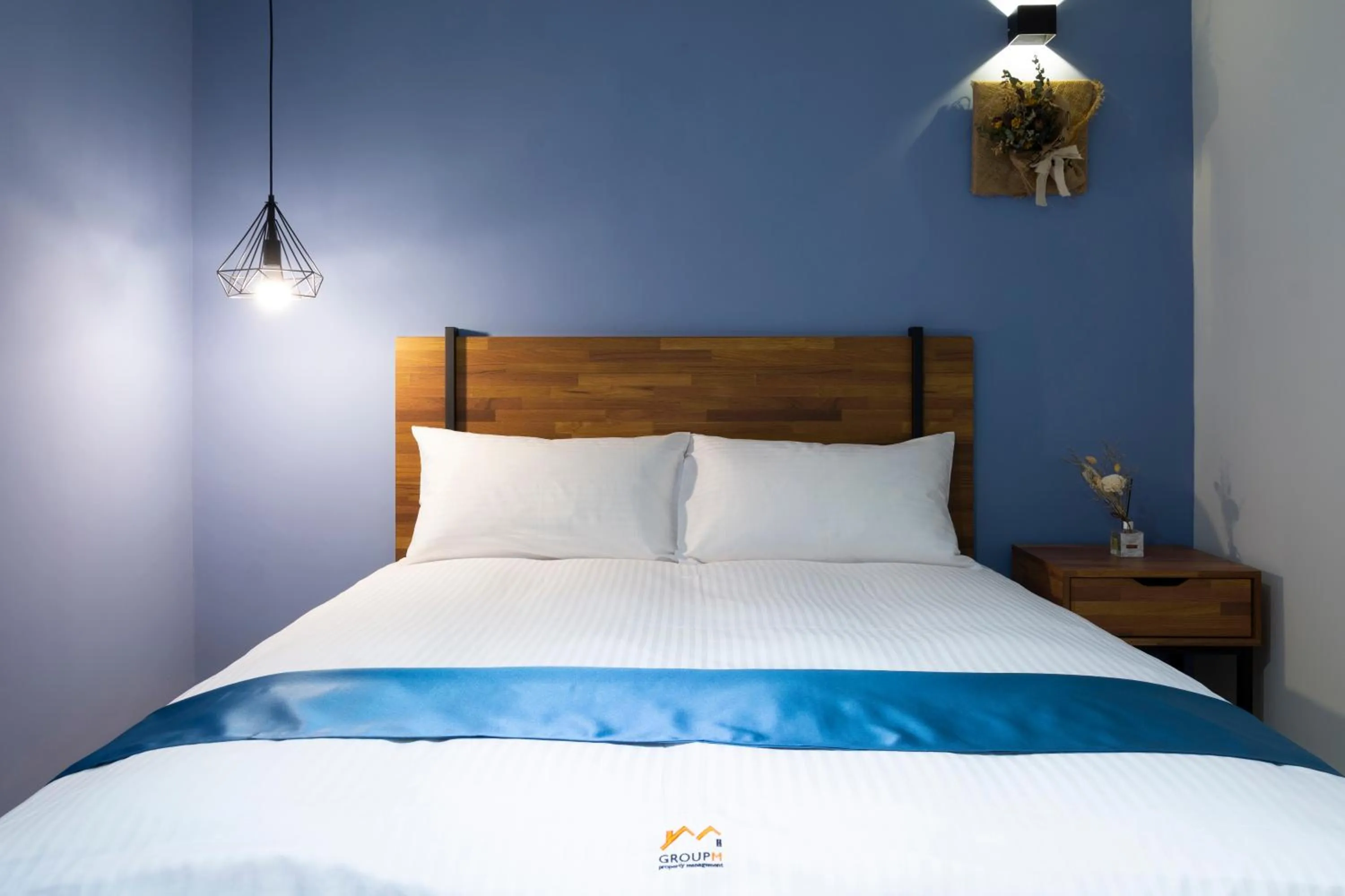 Bed in 沐藍輕旅 Mulan Light Inn I 海安路住宿