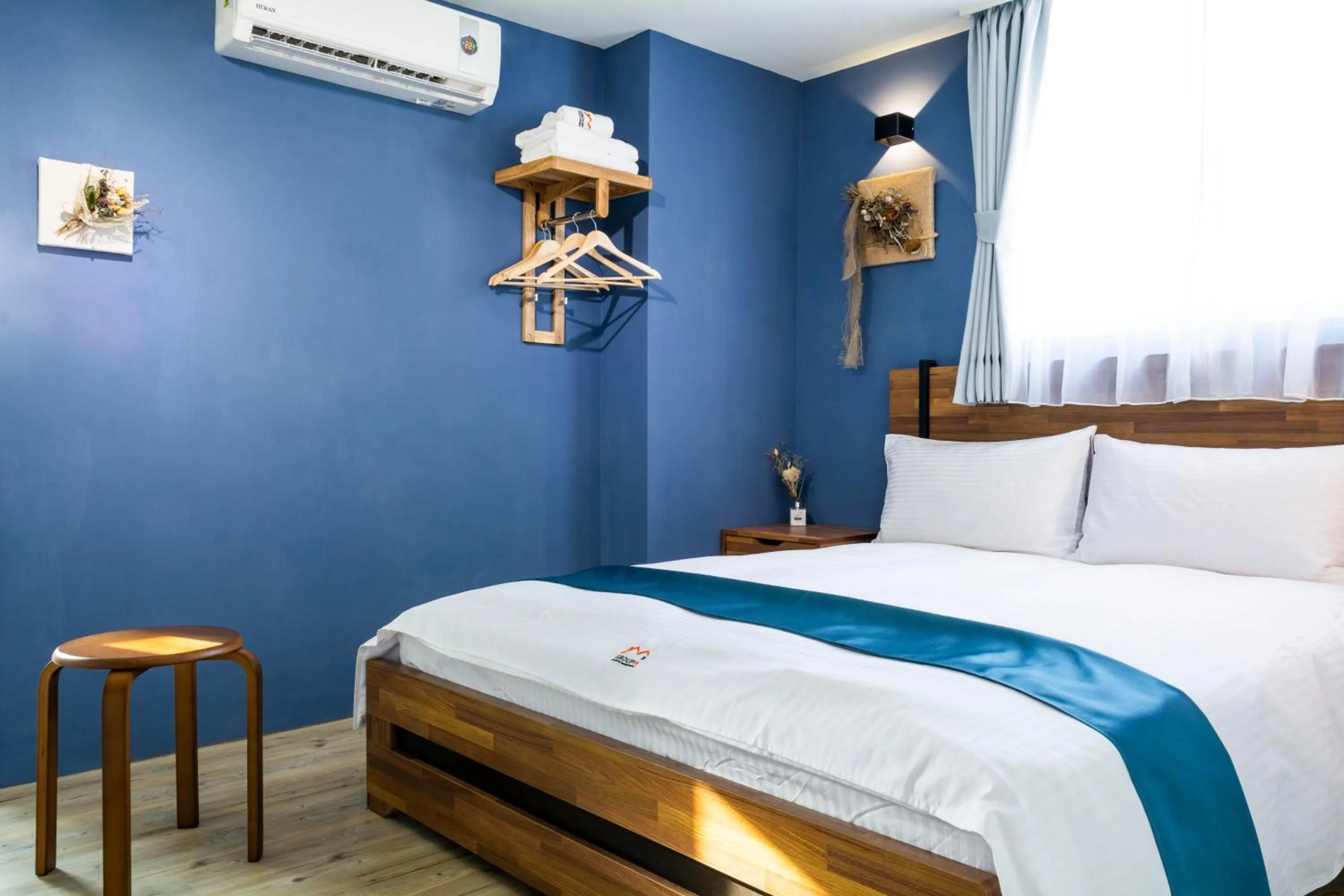 Bed in 沐藍輕旅 Mulan Light Inn I 海安路住宿