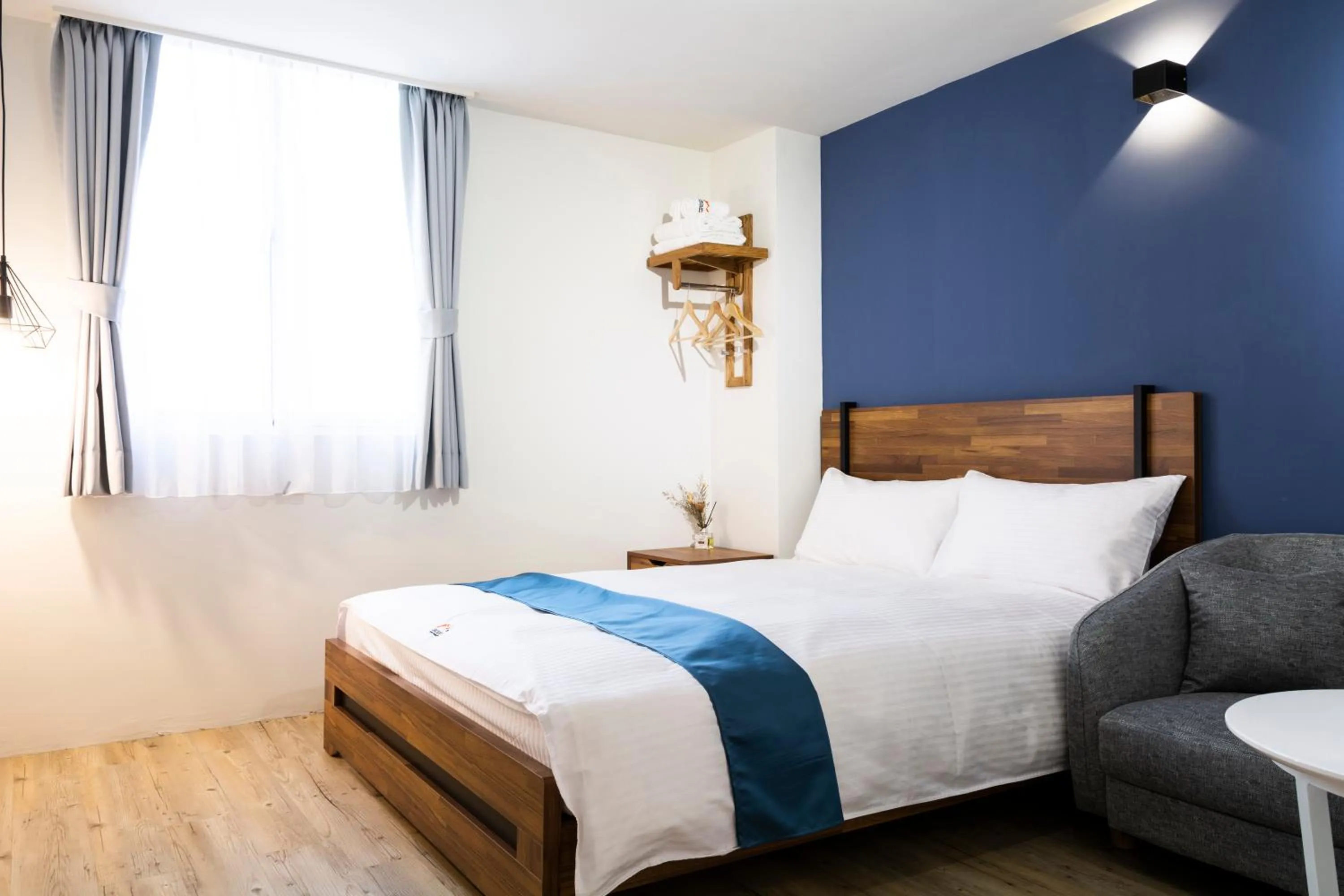 Bed in 沐藍輕旅 Mulan Light Inn I 海安路住宿