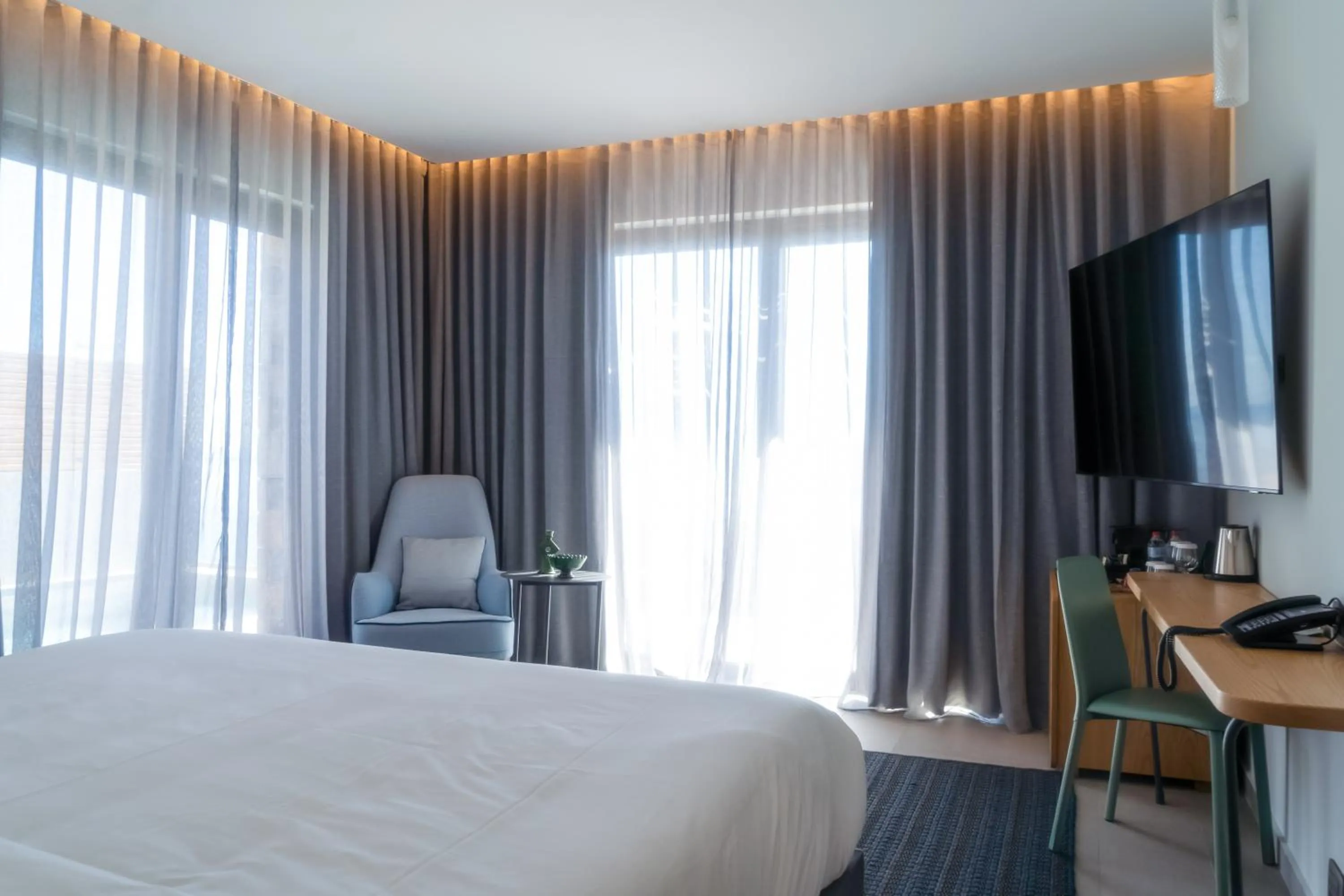 Bed in Cayo Exclusive Resort & Spa