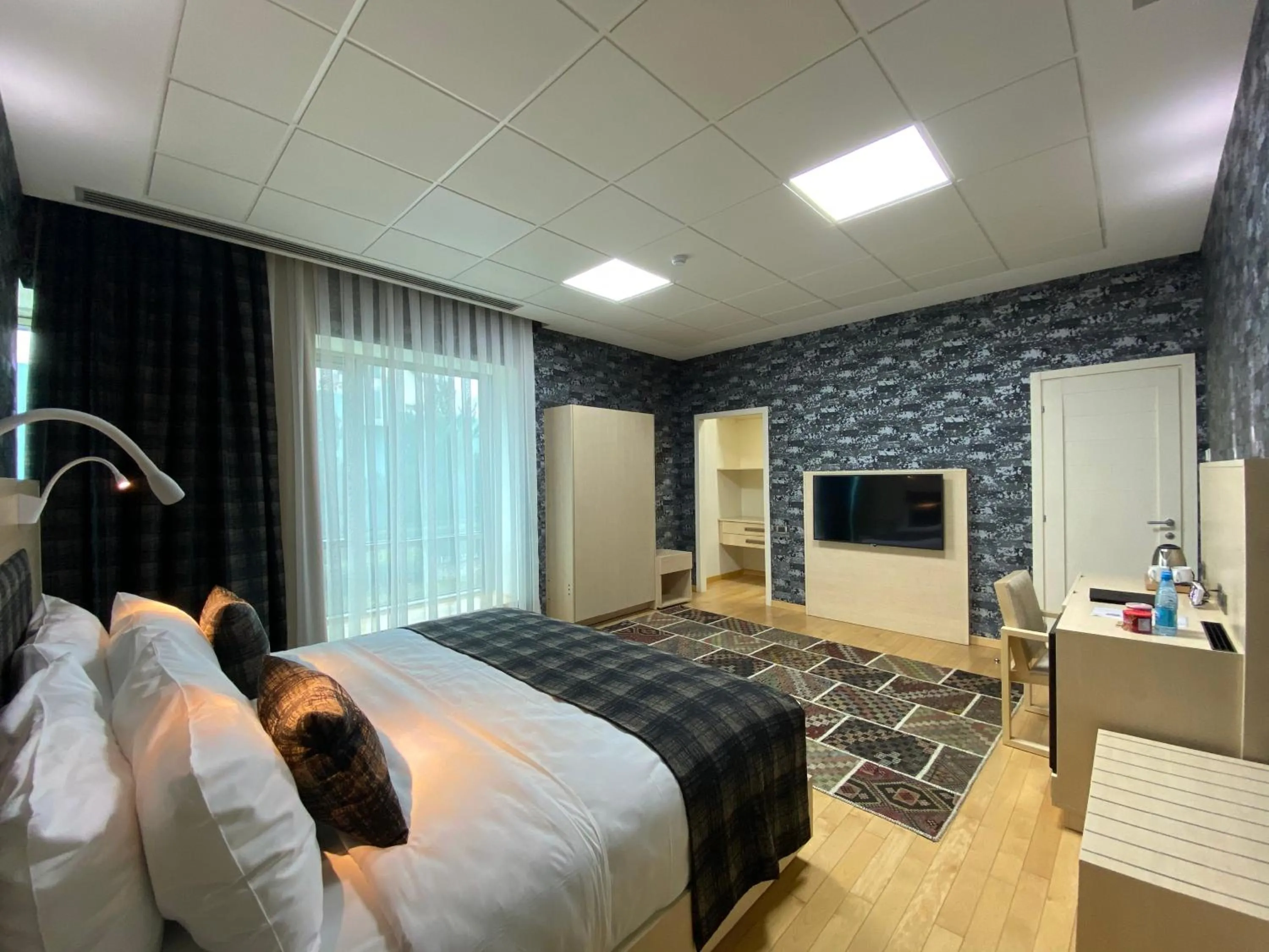 Communal lounge/ TV room, Bed in Badam d'Art Boutique Hotel