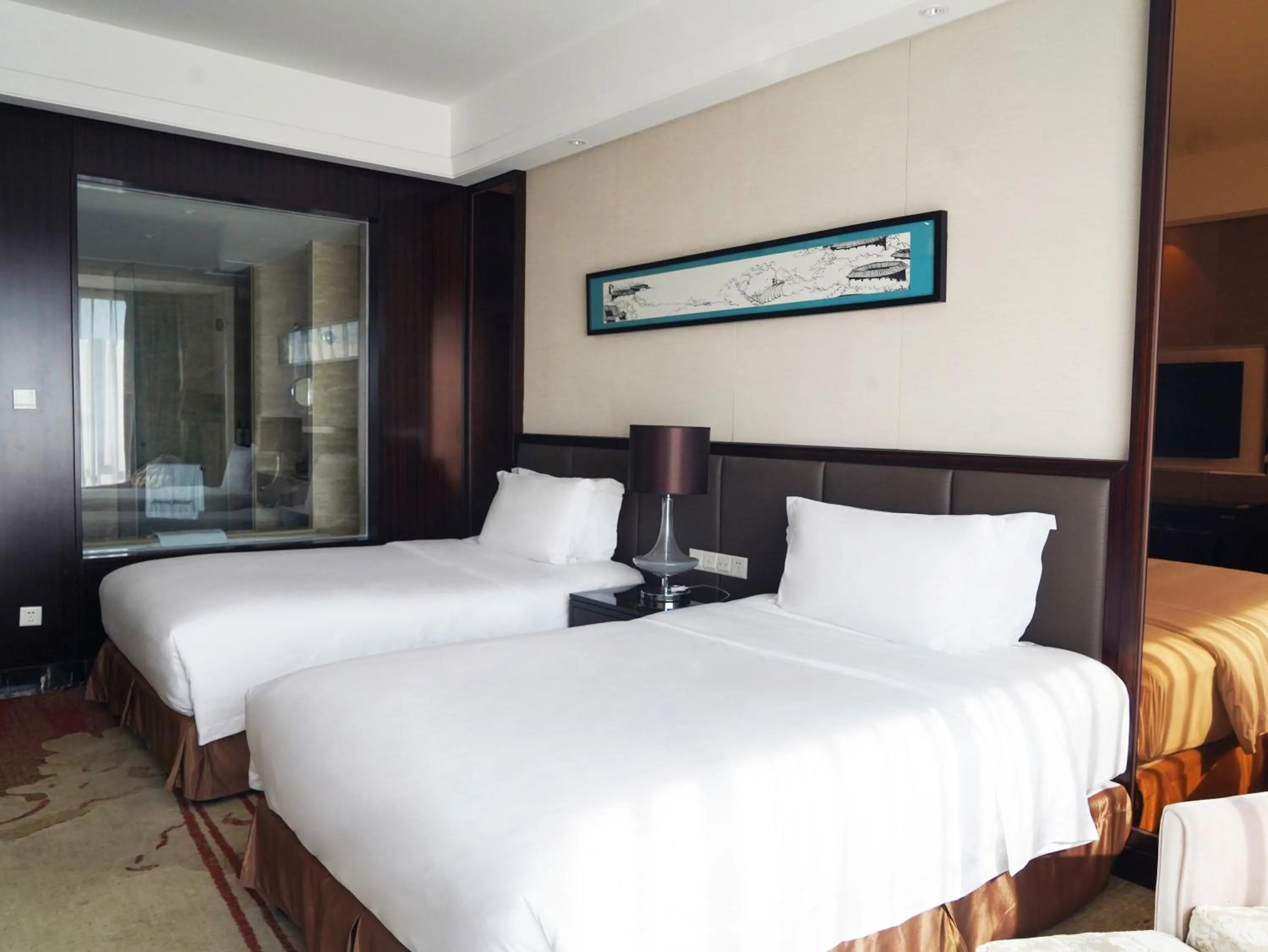 Bed in Howard Johnson Changsheng Plaza Meizhou