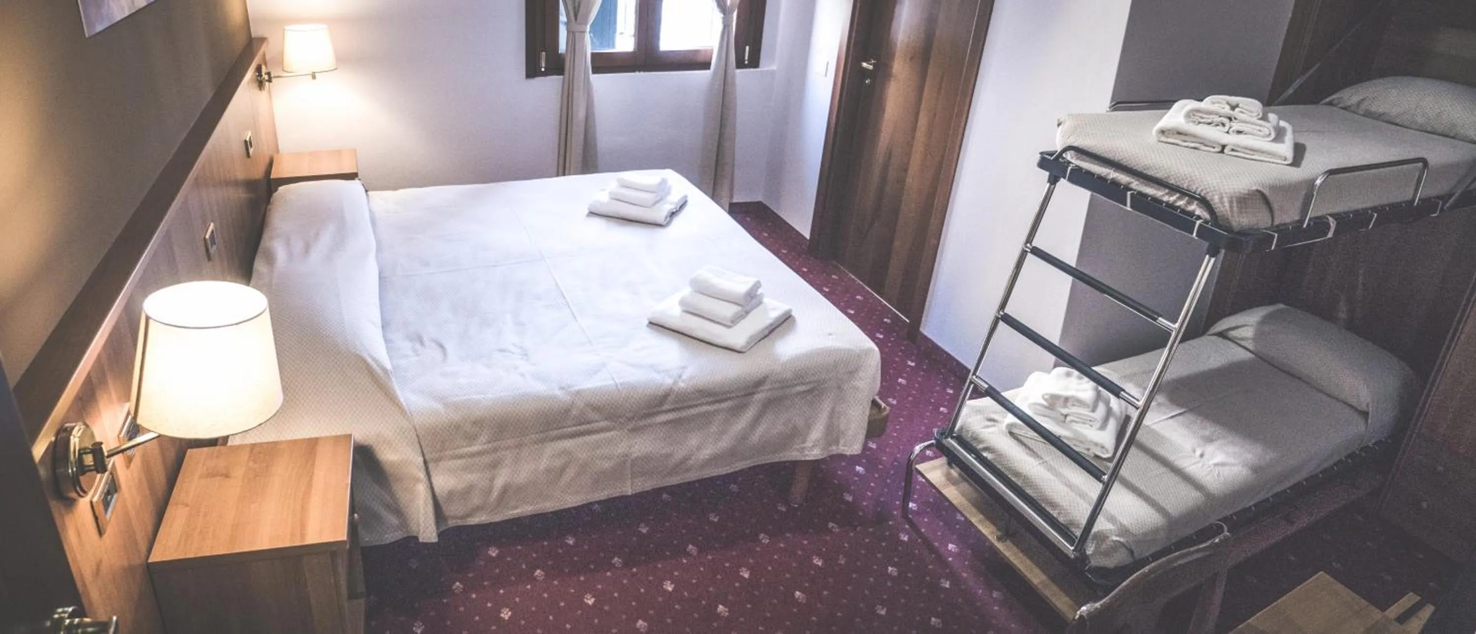 Bed in VILLANOVA HOTEL