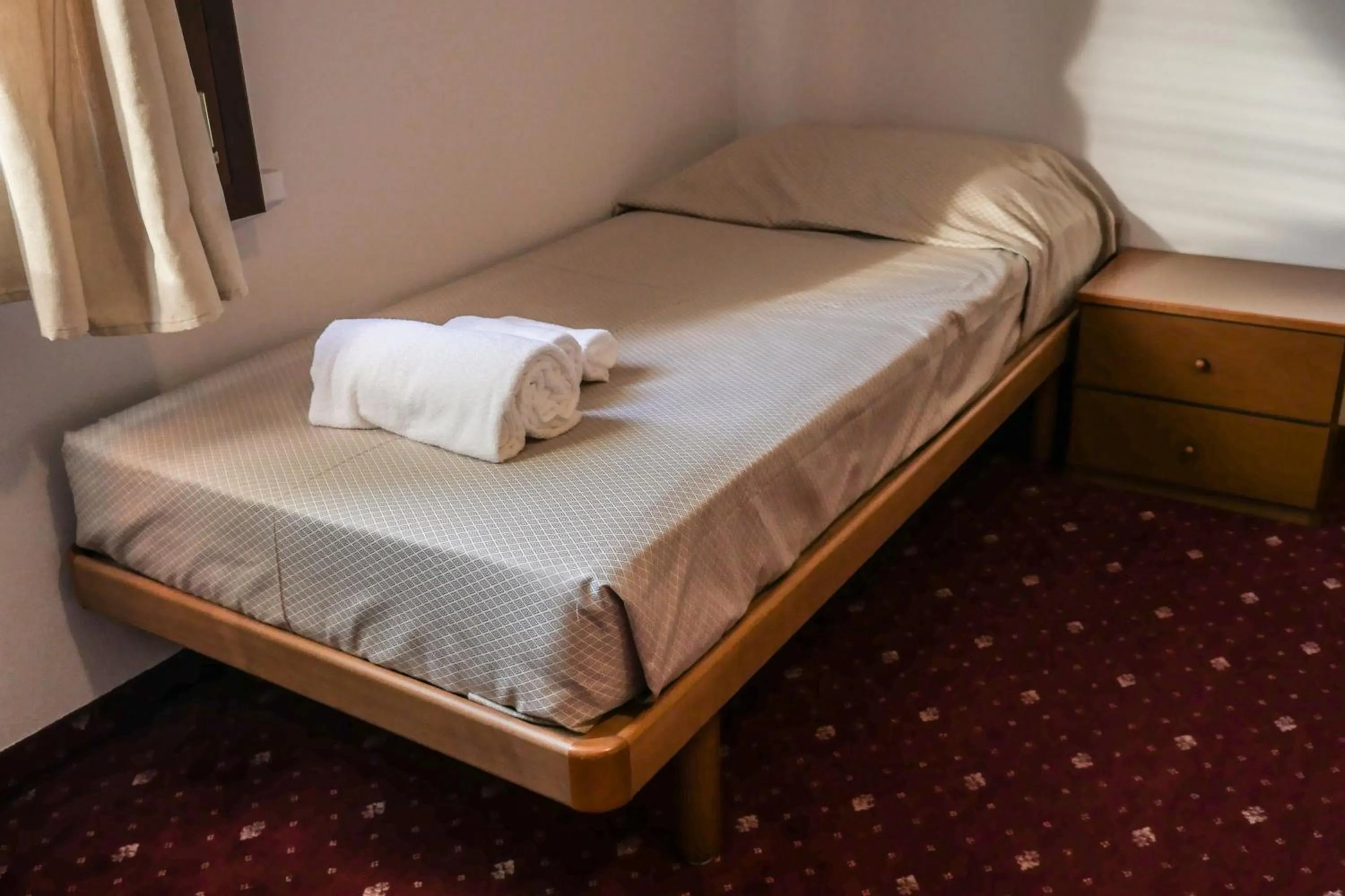 Bed in VILLANOVA HOTEL