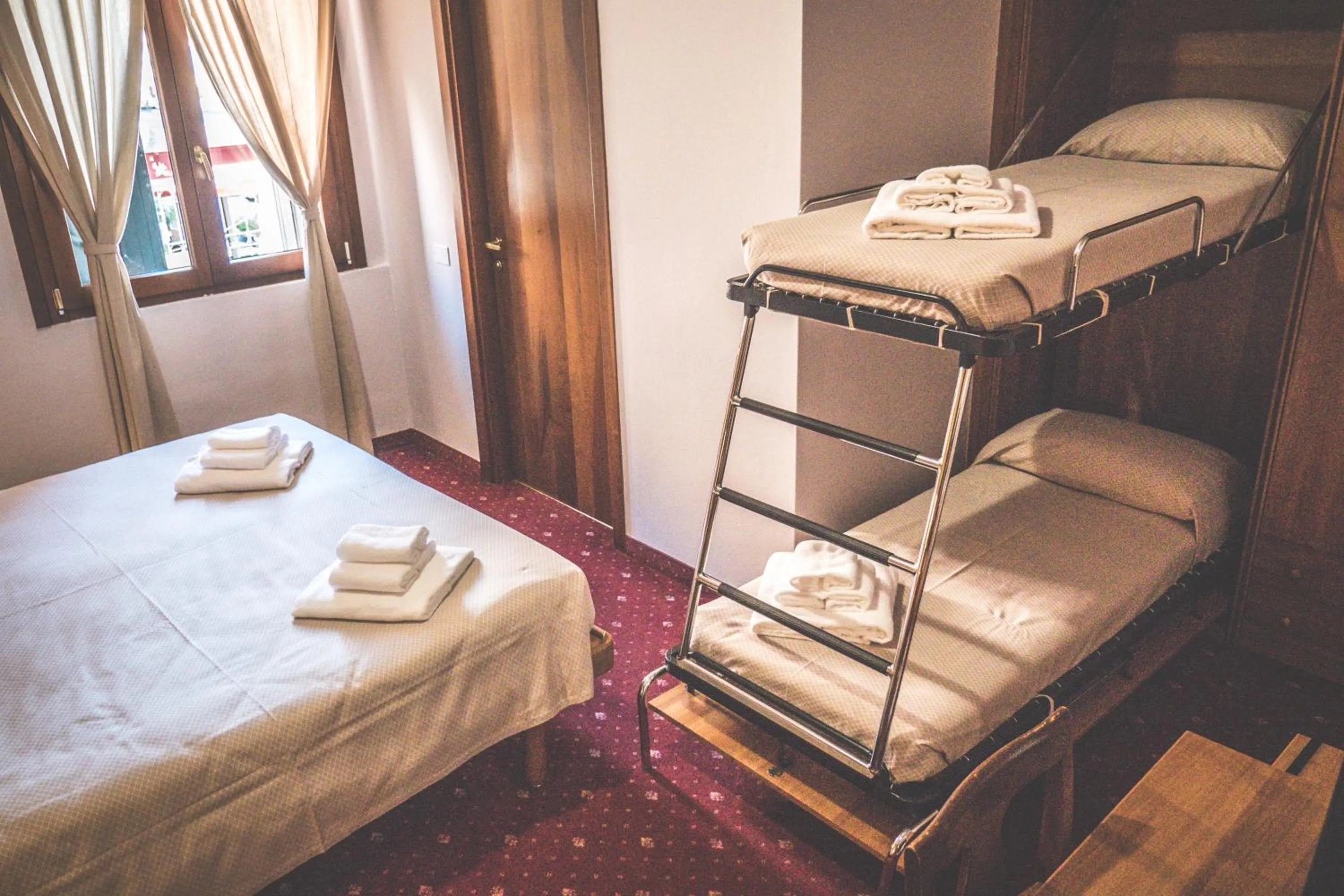 Bed in VILLANOVA HOTEL