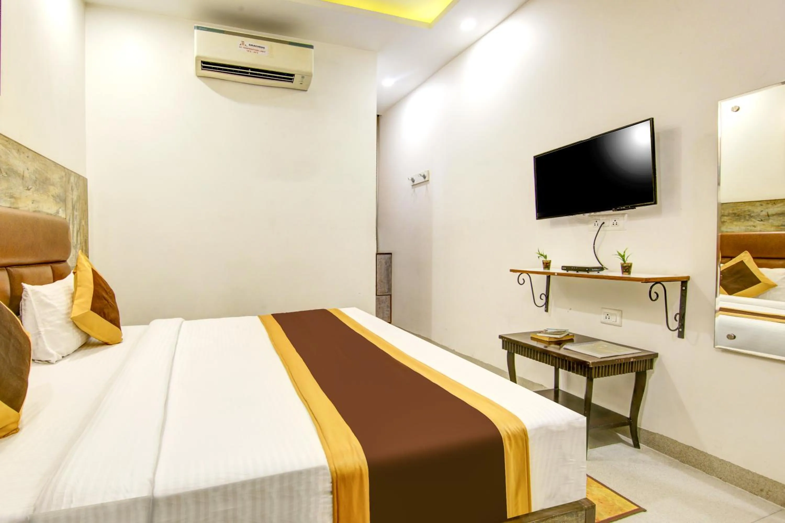 Bedroom, Bed in Gracious by Vishesh Hotels & Home Stay