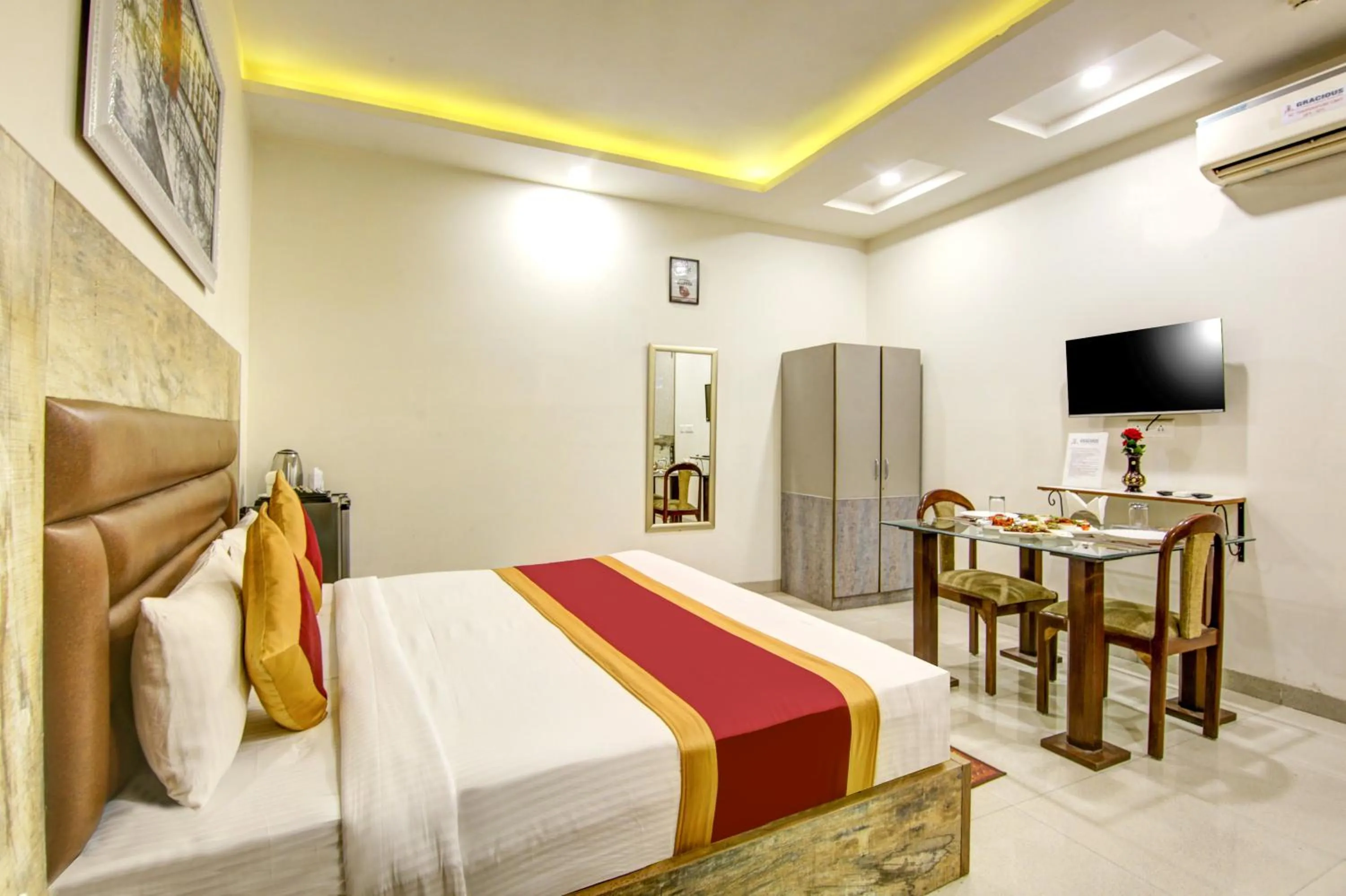 Dining area, Bed in Gracious by Vishesh Hotels & Home Stay