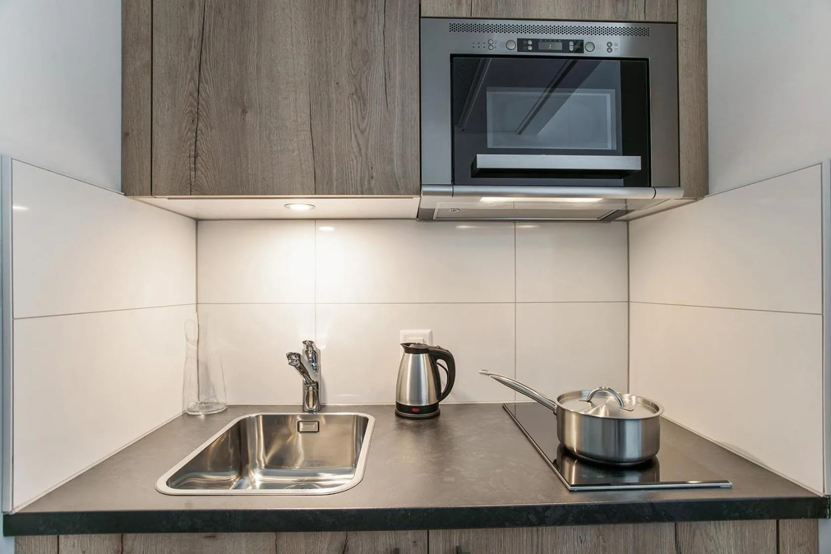 Kitchen or kitchenette in Appart'City Collection Genève Aéroport - Vernier