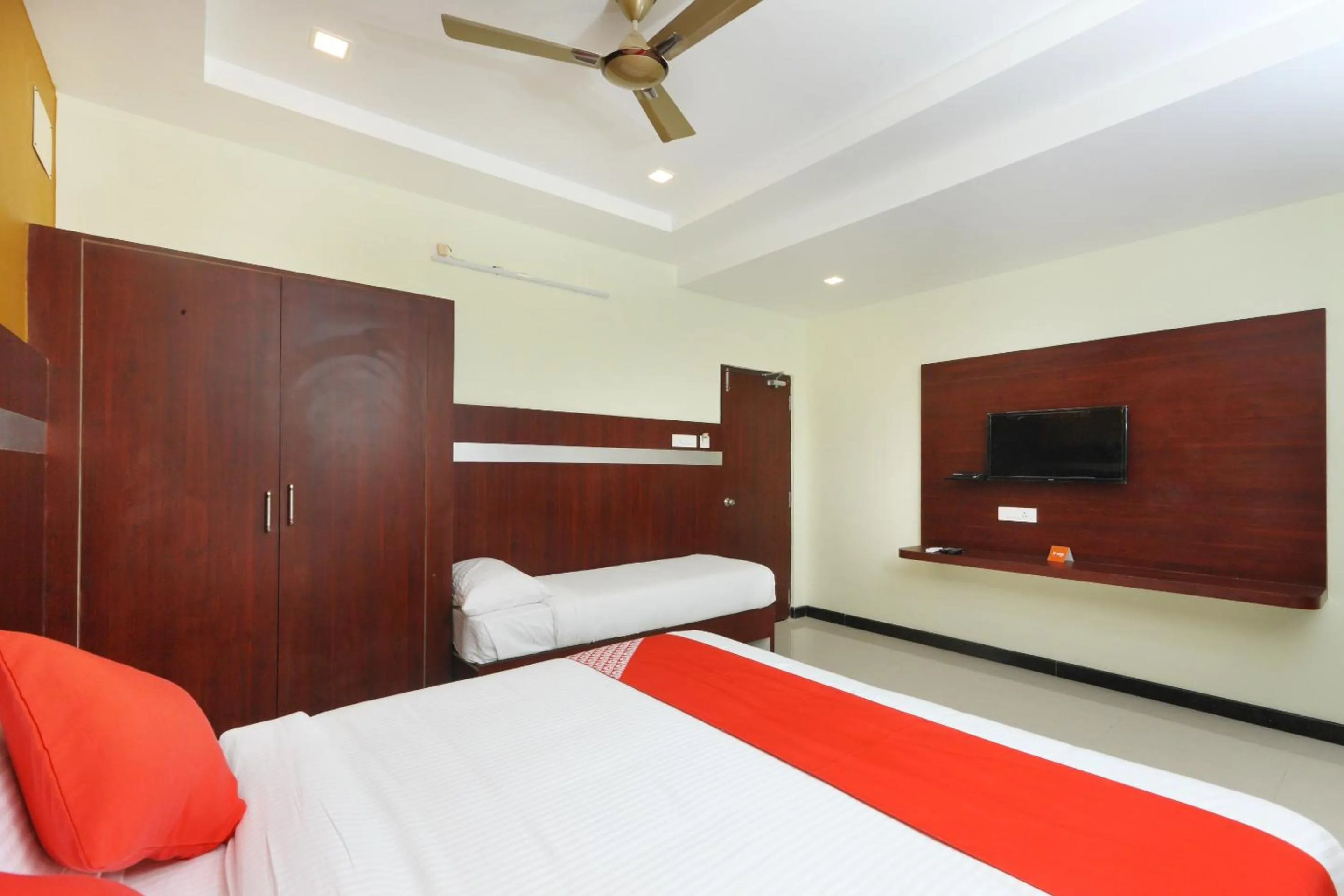 Photo of the whole room, Bed in Hotel Ramcharan Residency, Tirupati