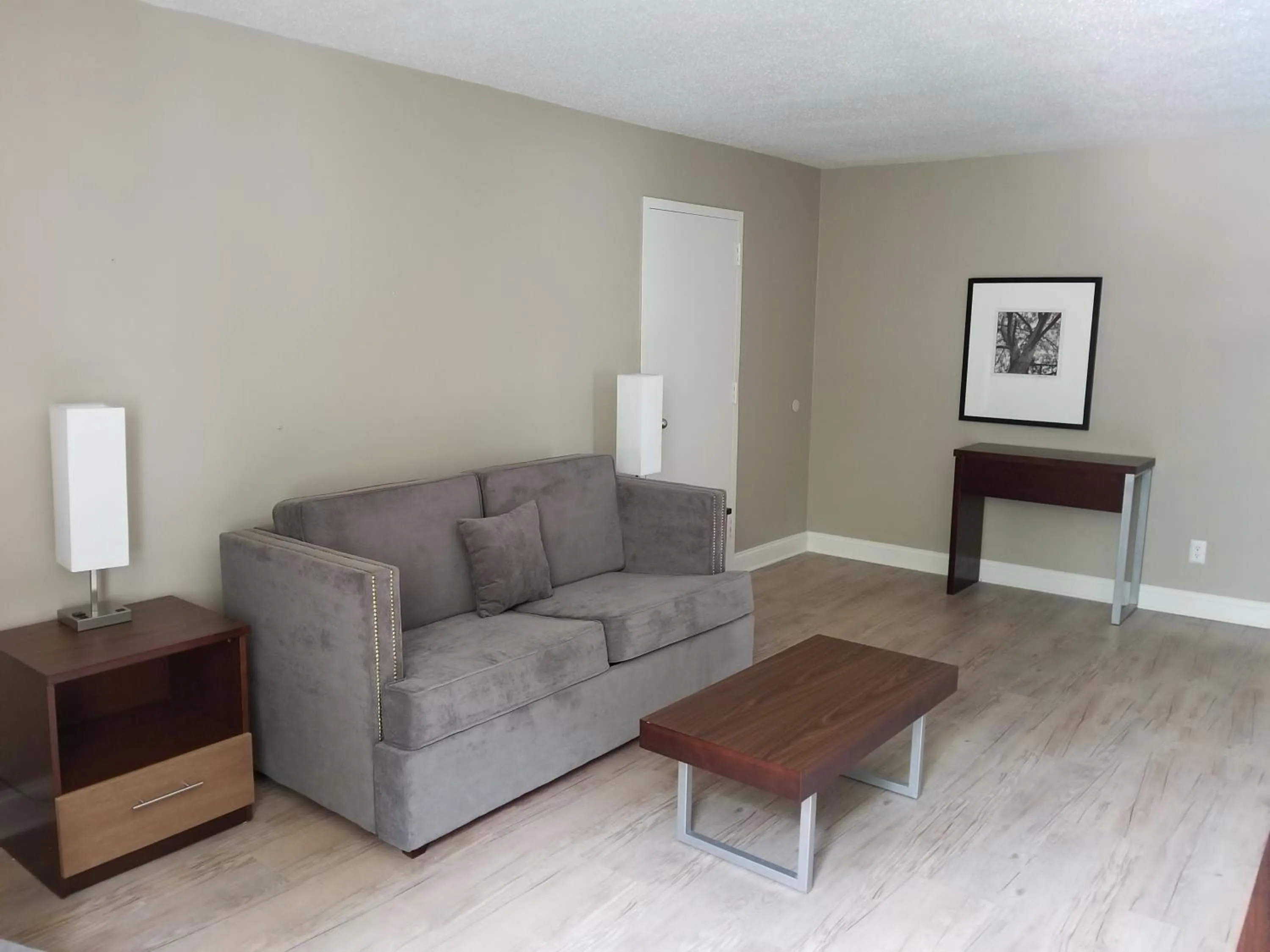 Bed, Seating Area in Stayable Select Gainesville