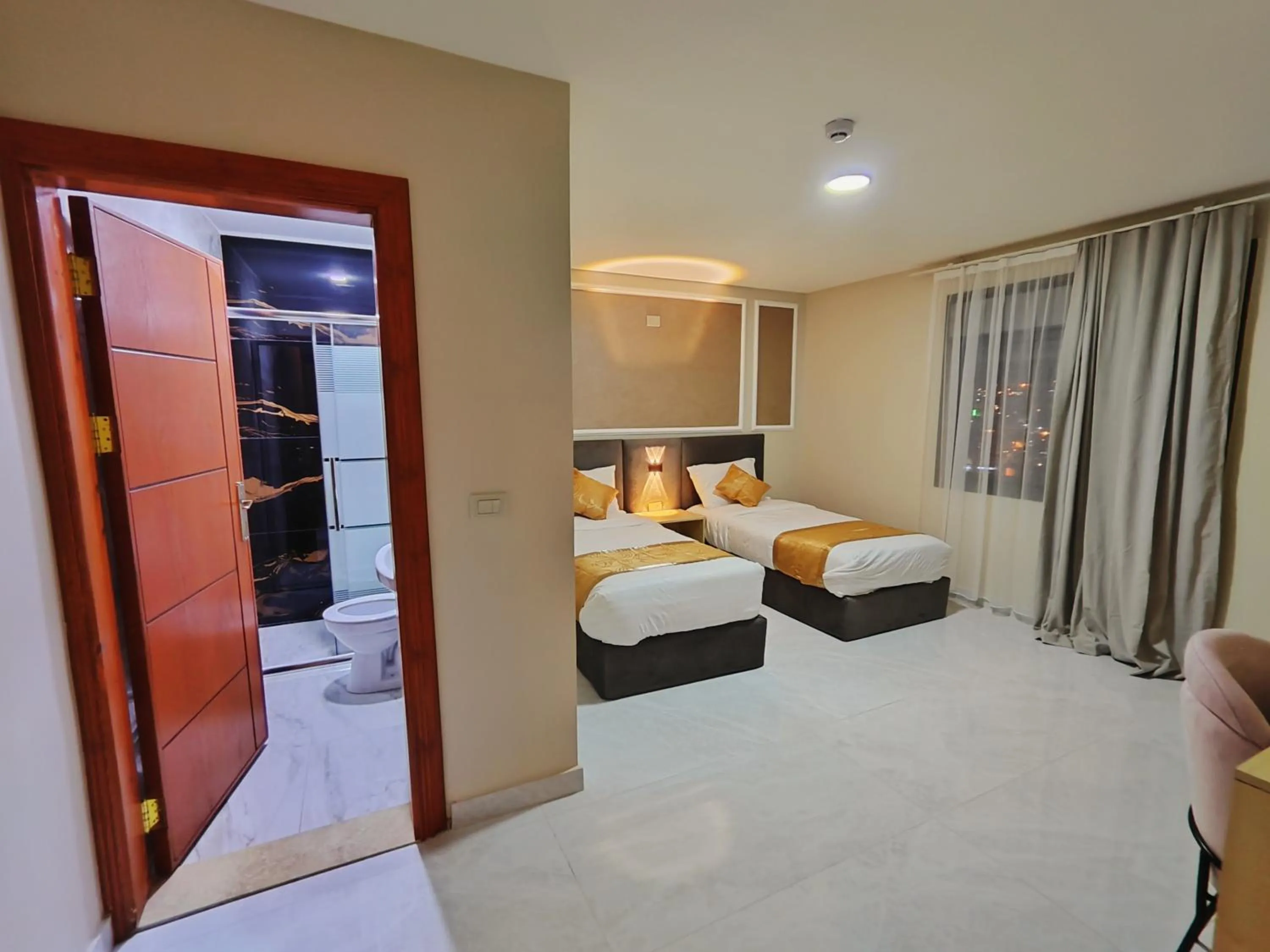 Bed in Rakan ApartHotel and Luxury Rooms
