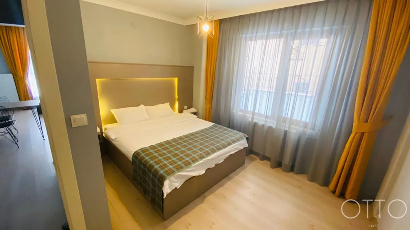 Bed in OTTO LOFT Premium Apartments