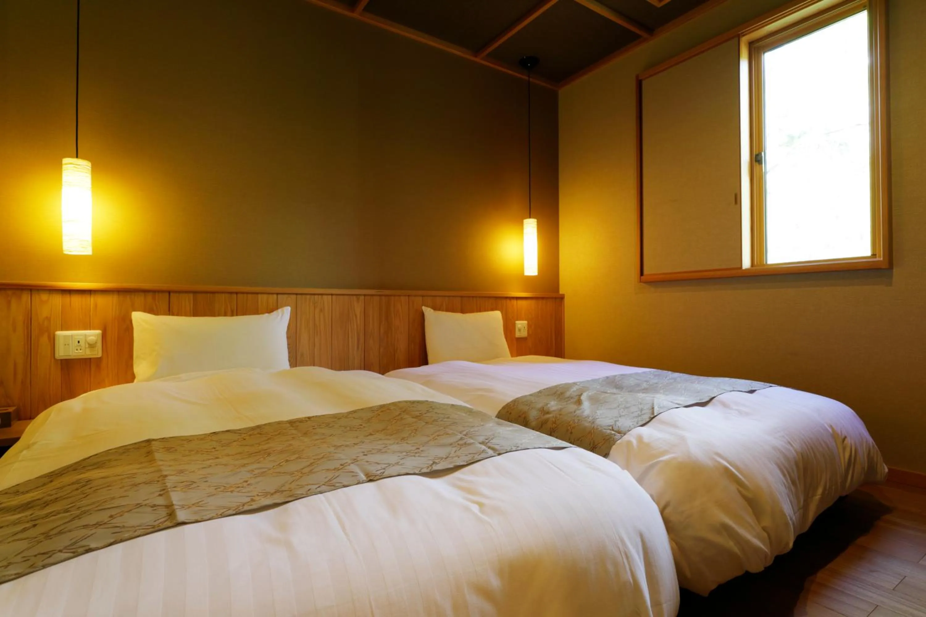 Bed in Yukemuri no Yado Inazumi Onsen