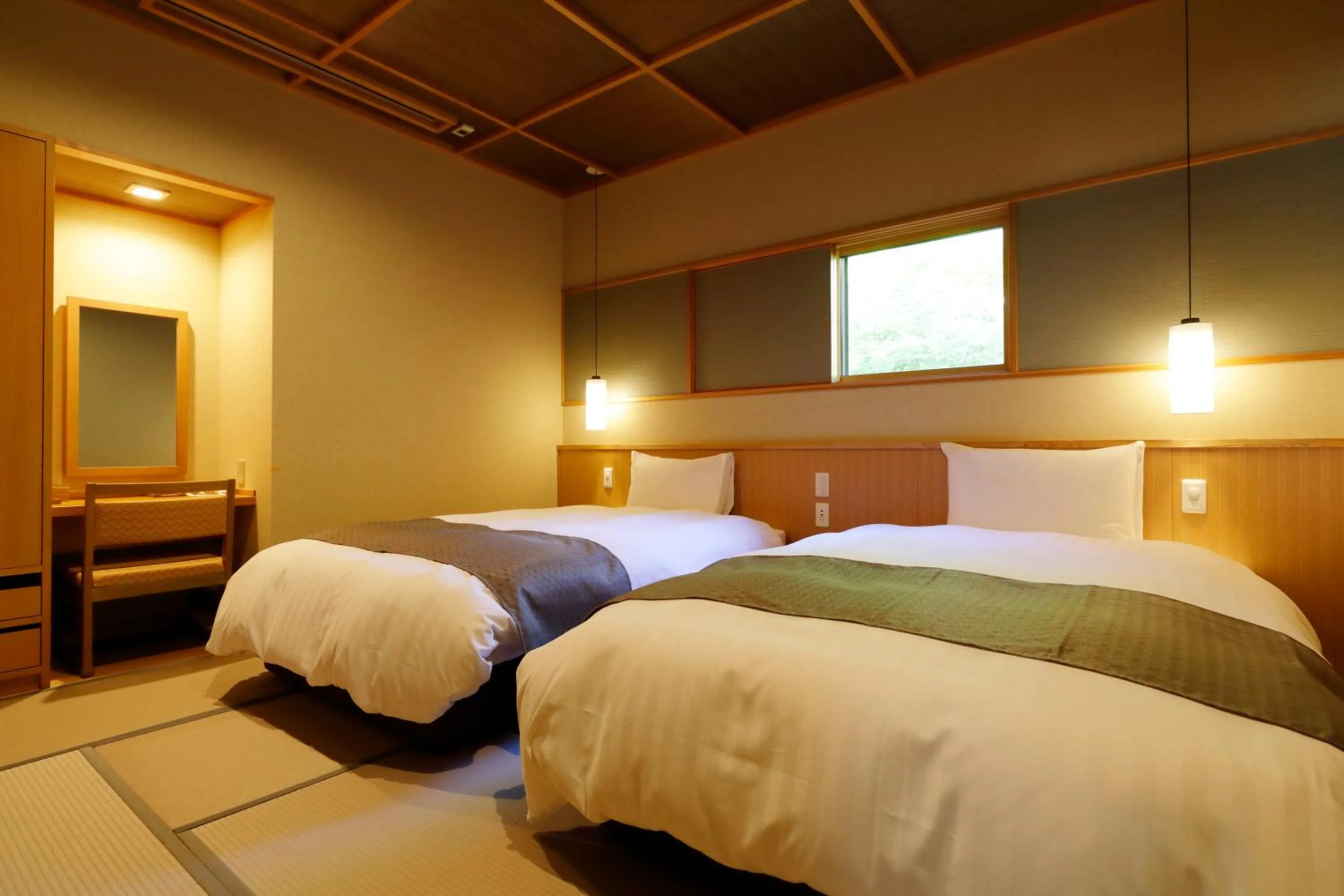 Bed in Yukemuri no Yado Inazumi Onsen