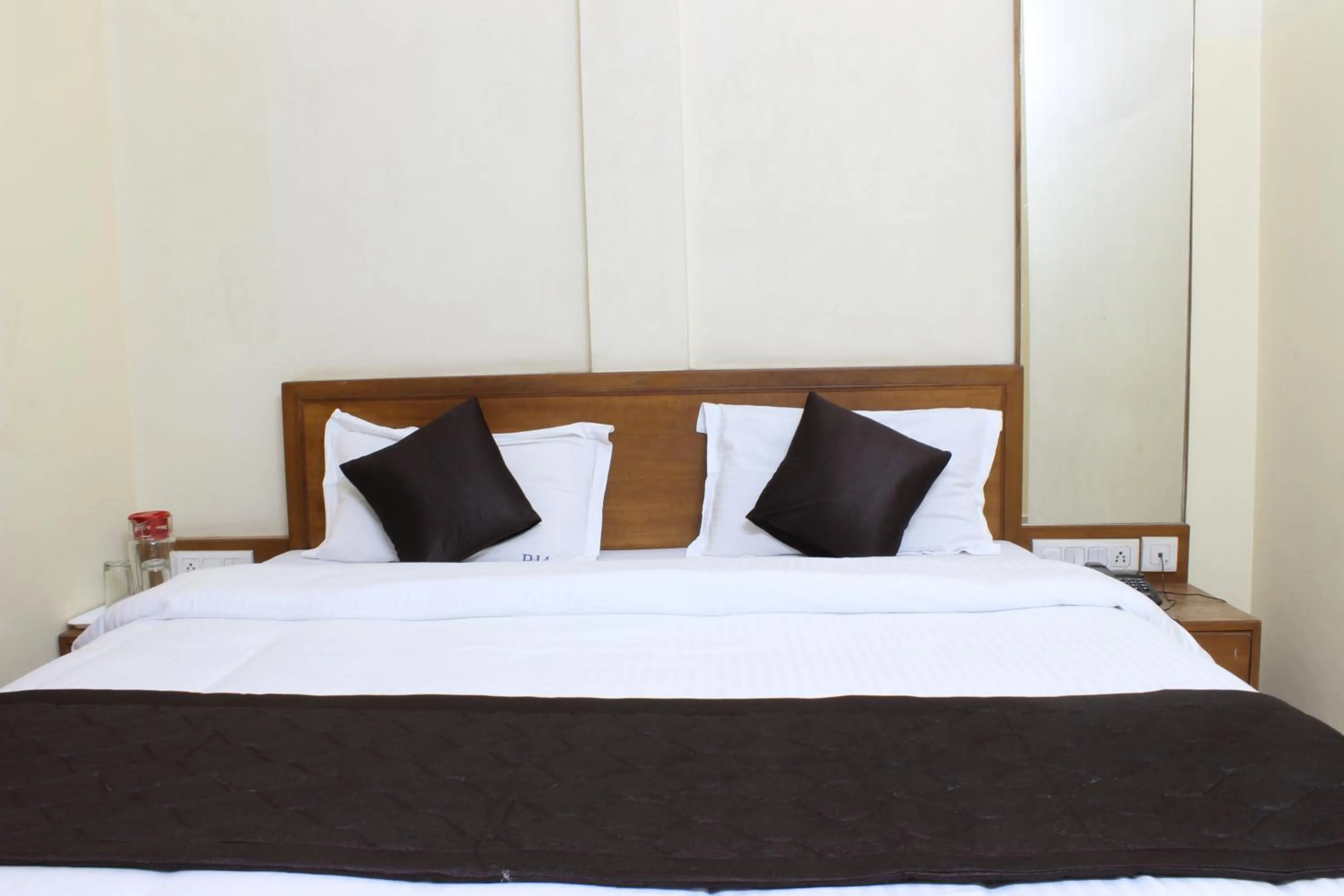 Bed in Ria Residency