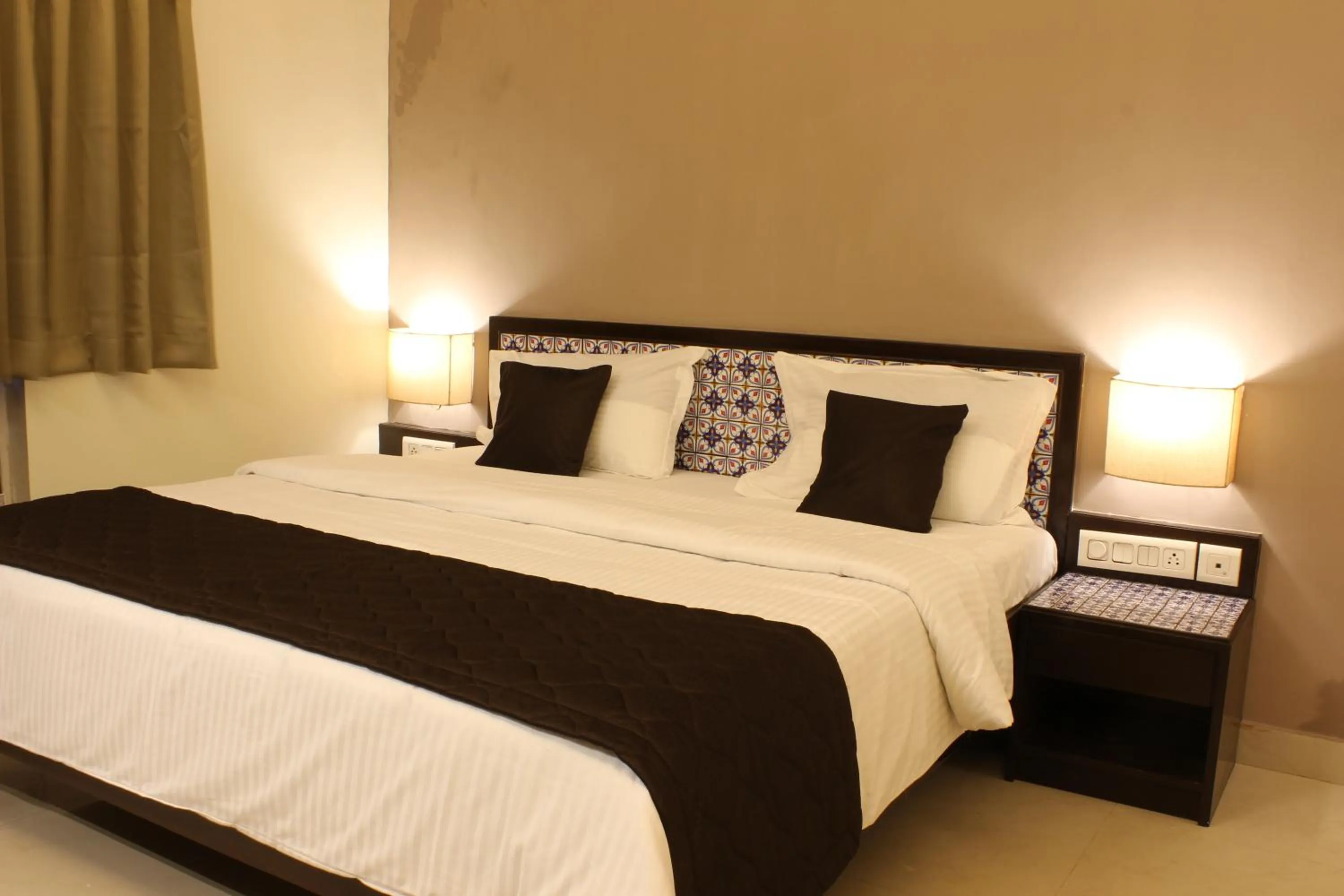 Bed in Ria Residency