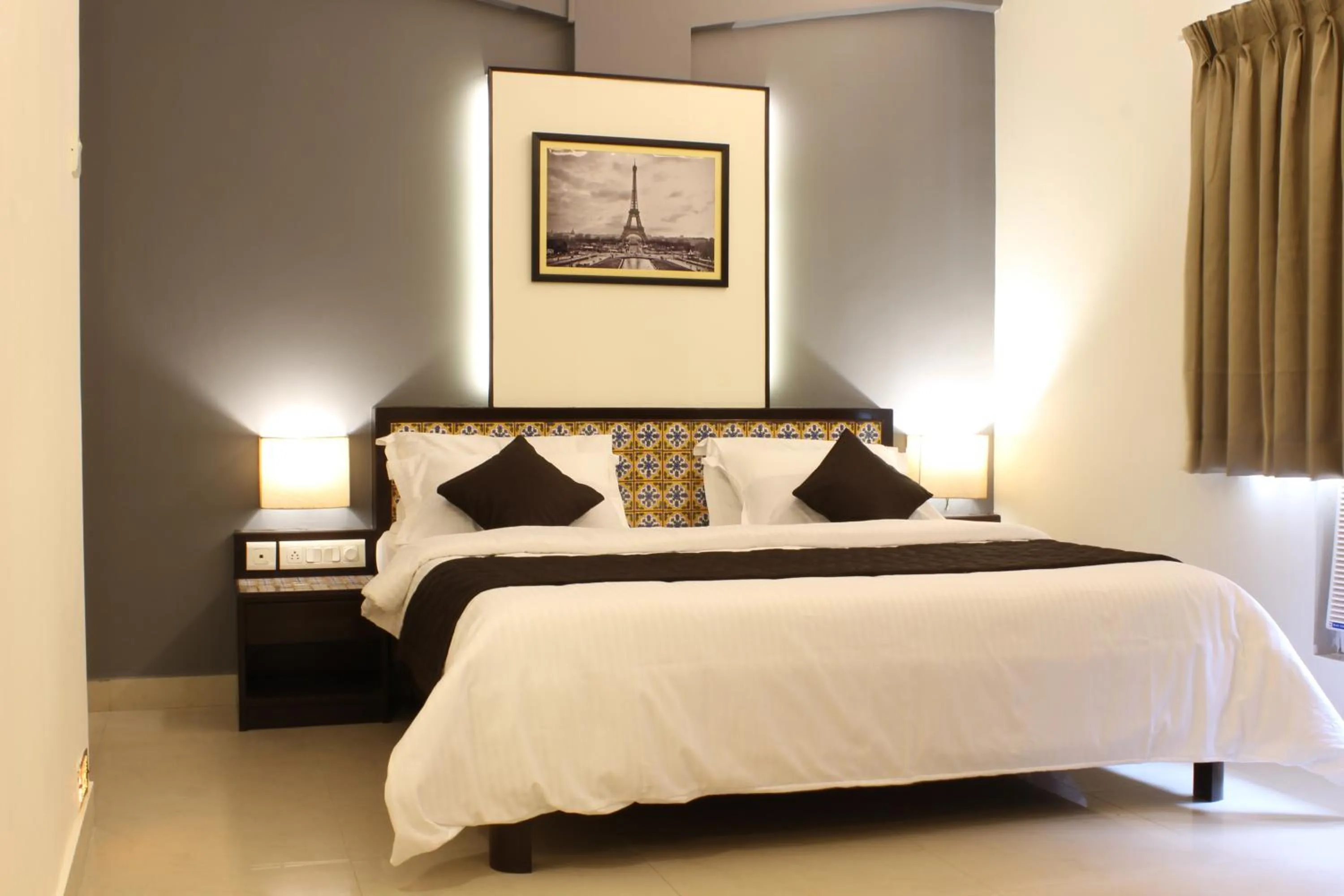 Bed in Ria Residency