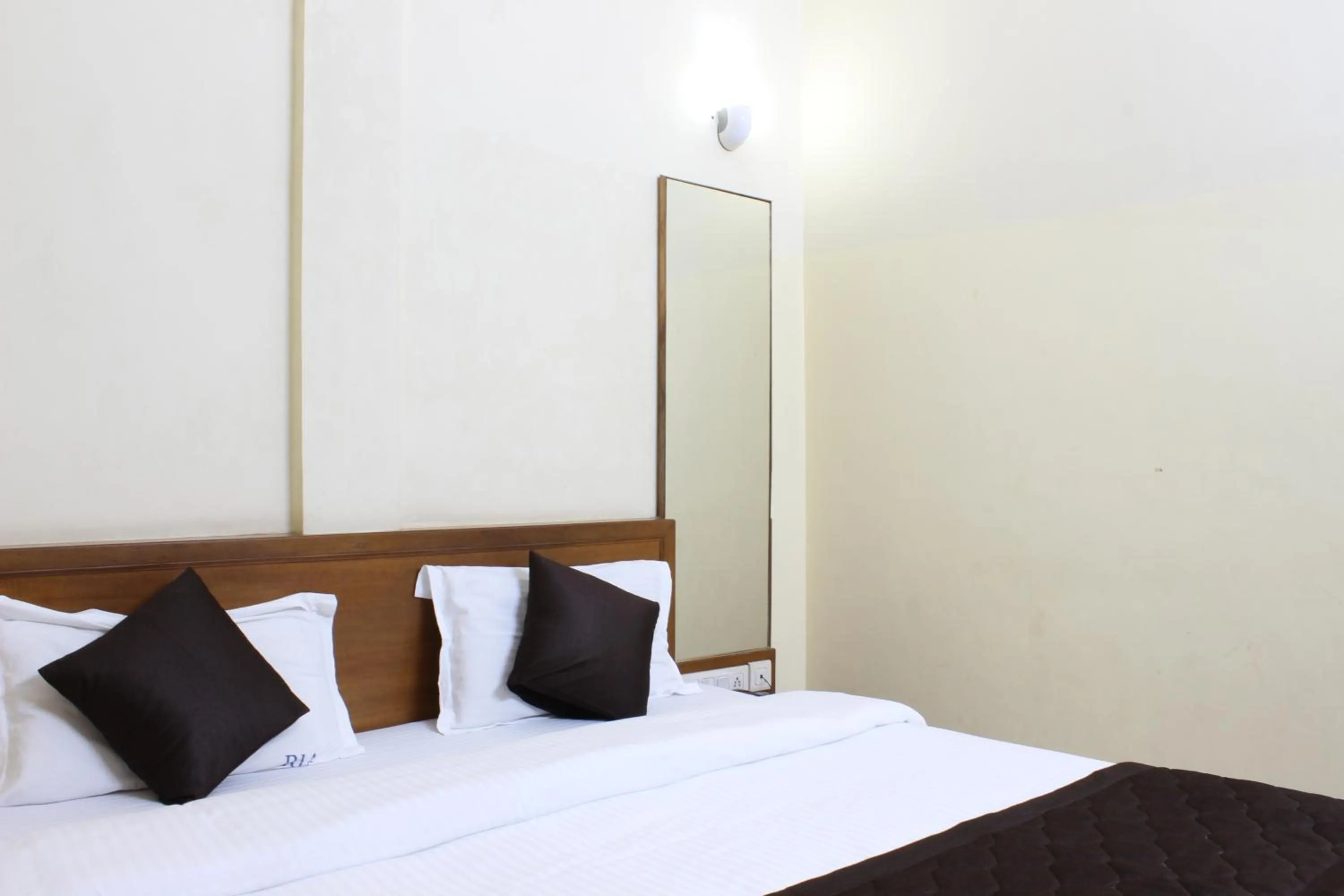 Bed in Ria Residency