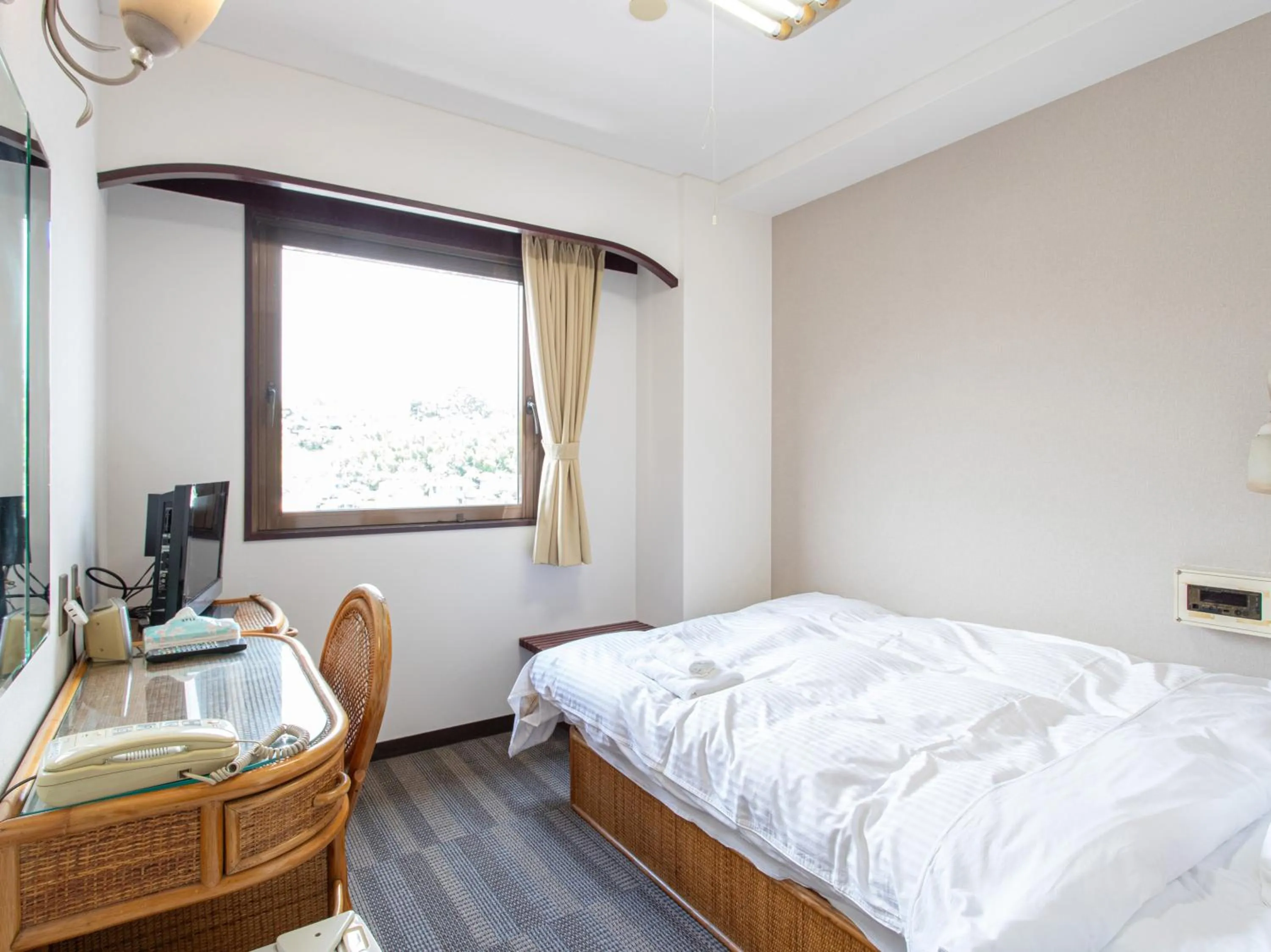 Photo of the whole room, Bed in Tabist New World Hotel Kagoshima Kanoya