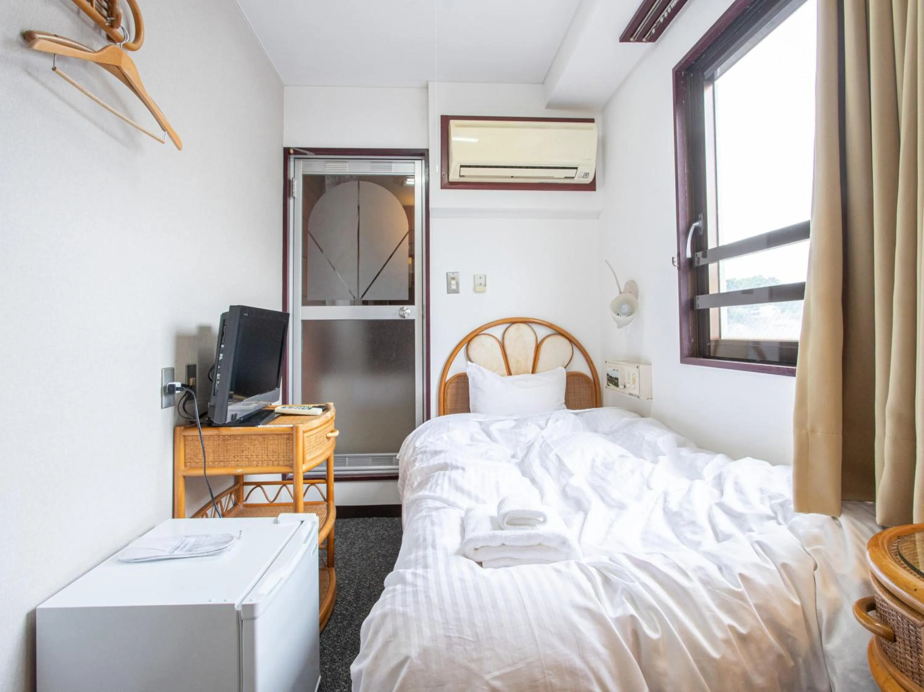 Photo of the whole room, Bed in Tabist New World Hotel Kagoshima Kanoya