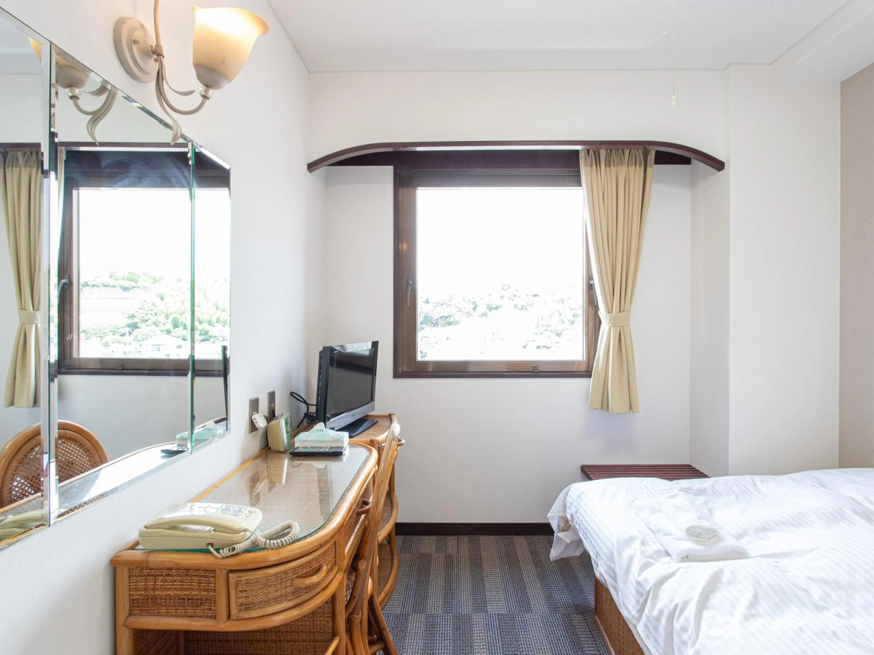 Photo of the whole room, Bed in Tabist New World Hotel Kagoshima Kanoya