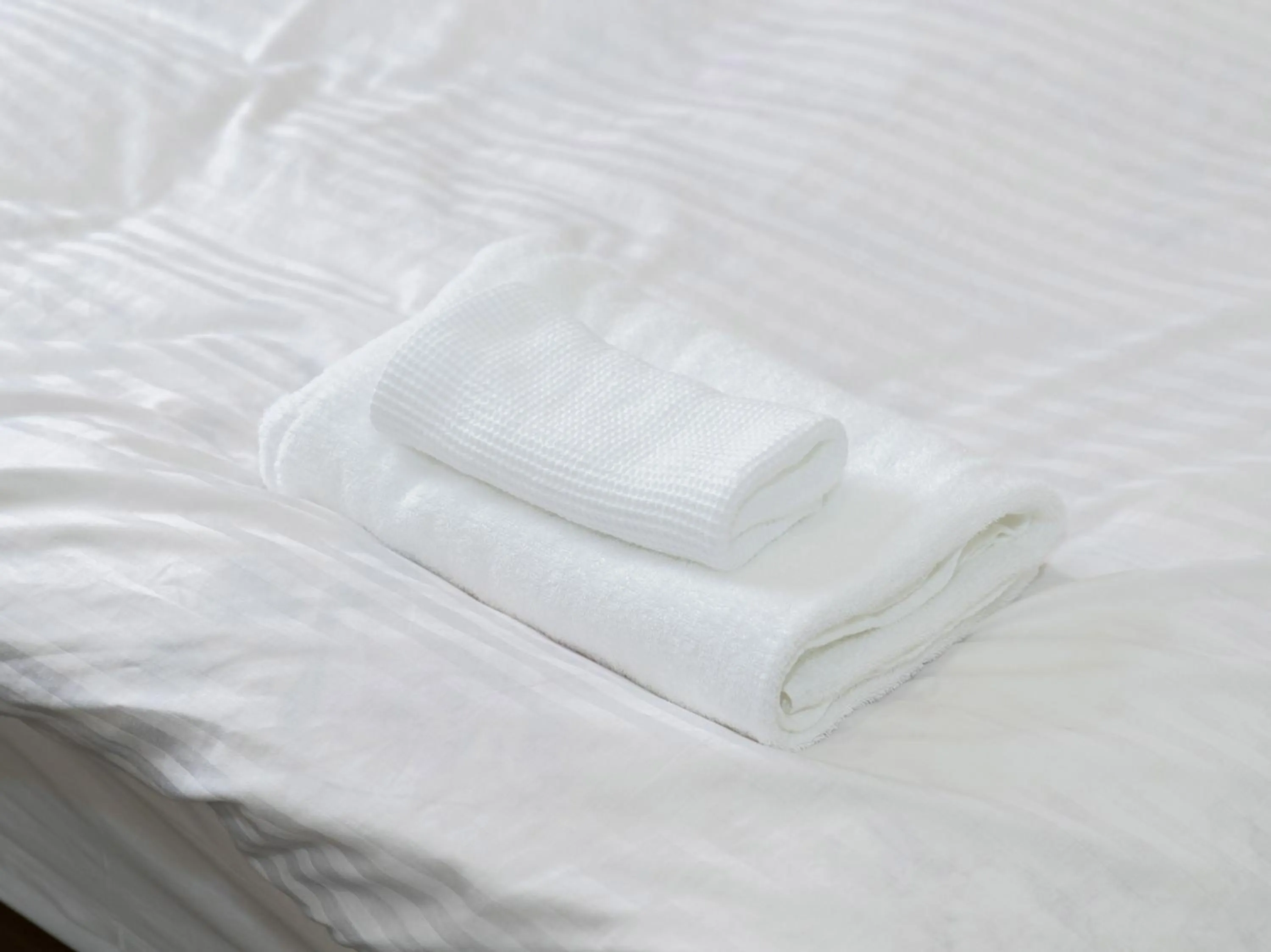 Photo of the whole room, Bed in Tabist New World Hotel Kagoshima Kanoya