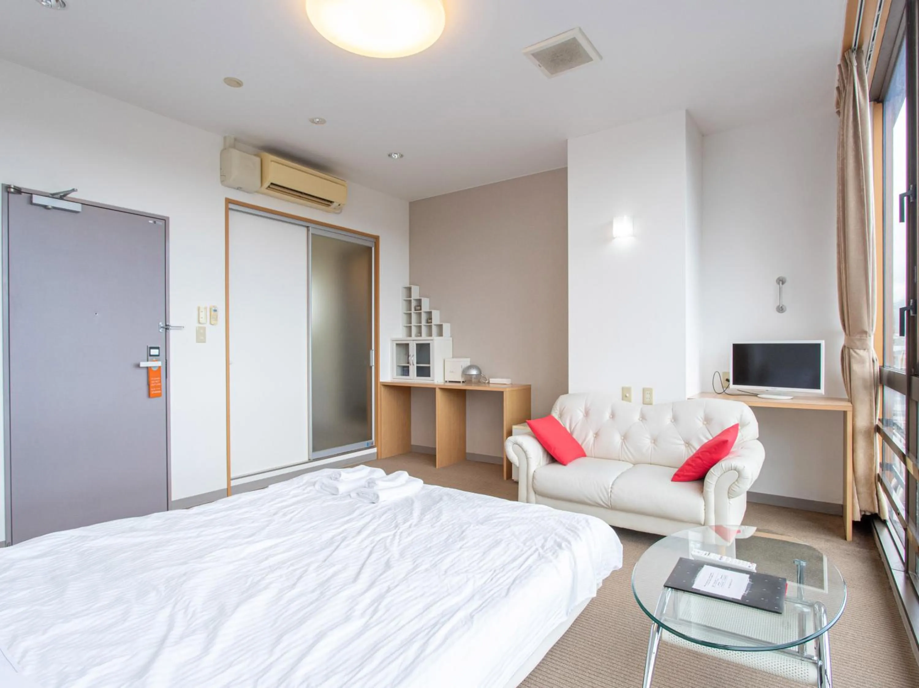 Photo of the whole room, Bed in Tabist New World Hotel Kagoshima Kanoya