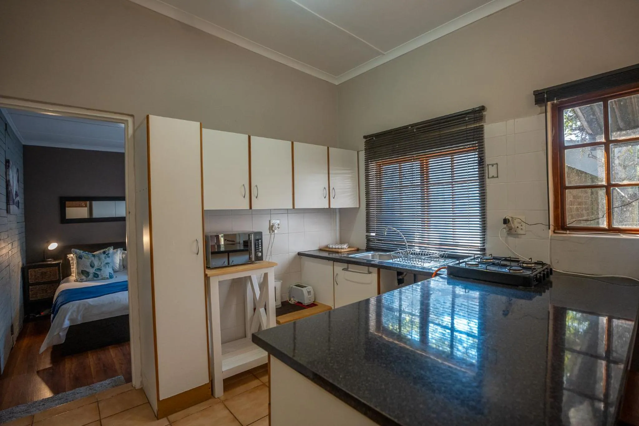 Kitchen or kitchenette in Palm Tree Manor