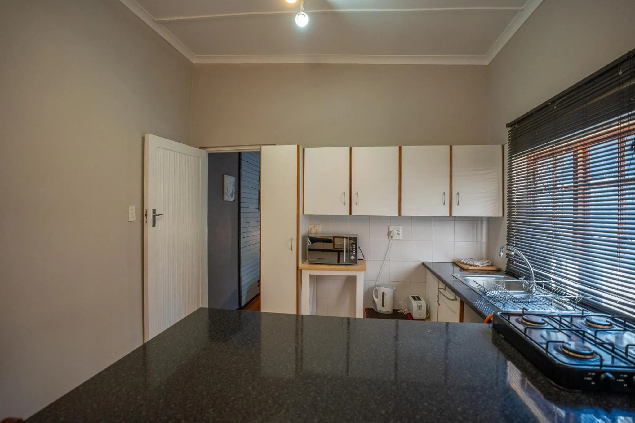 Kitchen or kitchenette in Palm Tree Manor