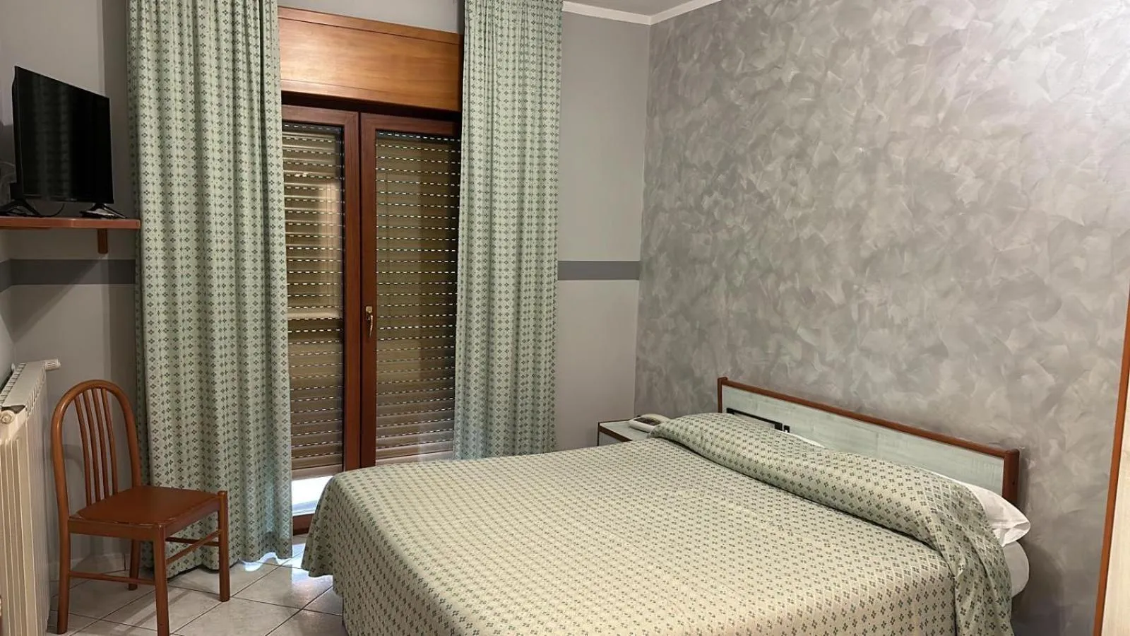 Bed in Hotel Paradiso